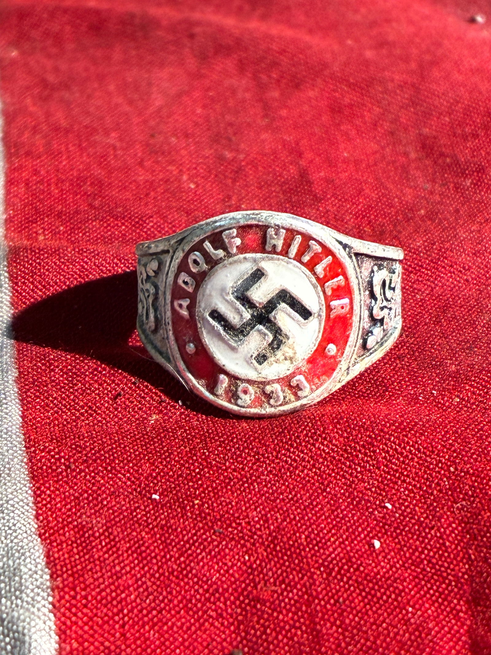 WW2 German 1933 ADOLF HITLER SILVER RING: WW2 German 1933 ADOLF HITLER SILVER RING. A RARE FIND. SHOWS GOOD WEAR AND USE WITH A BEAUTIFUL OVERALL PATINA. PLEASE VIEW ALL DETAILED PICTURES. A RARE EXAMPLE OF THE TIME PERIOD.