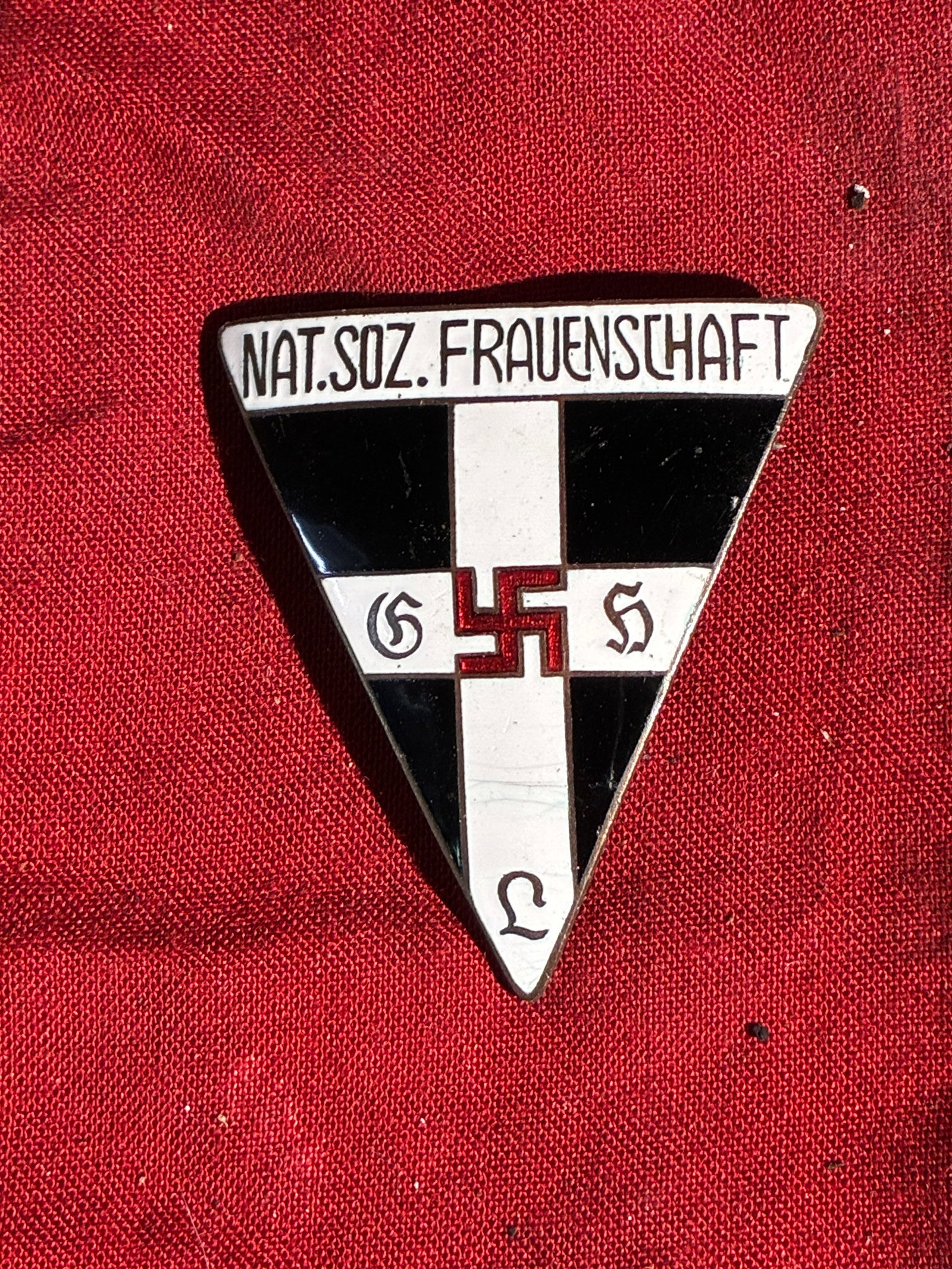 WW2 German National Socialist Women’s League Membership Badge (NS-Frauenschaft), c. 1930s: This triangular enameled badge represents the National Socialist Women’s League (Nationalsozialistische Frauenschaft), the official women’s organization of the Nazi Party during the 1930s and 1940