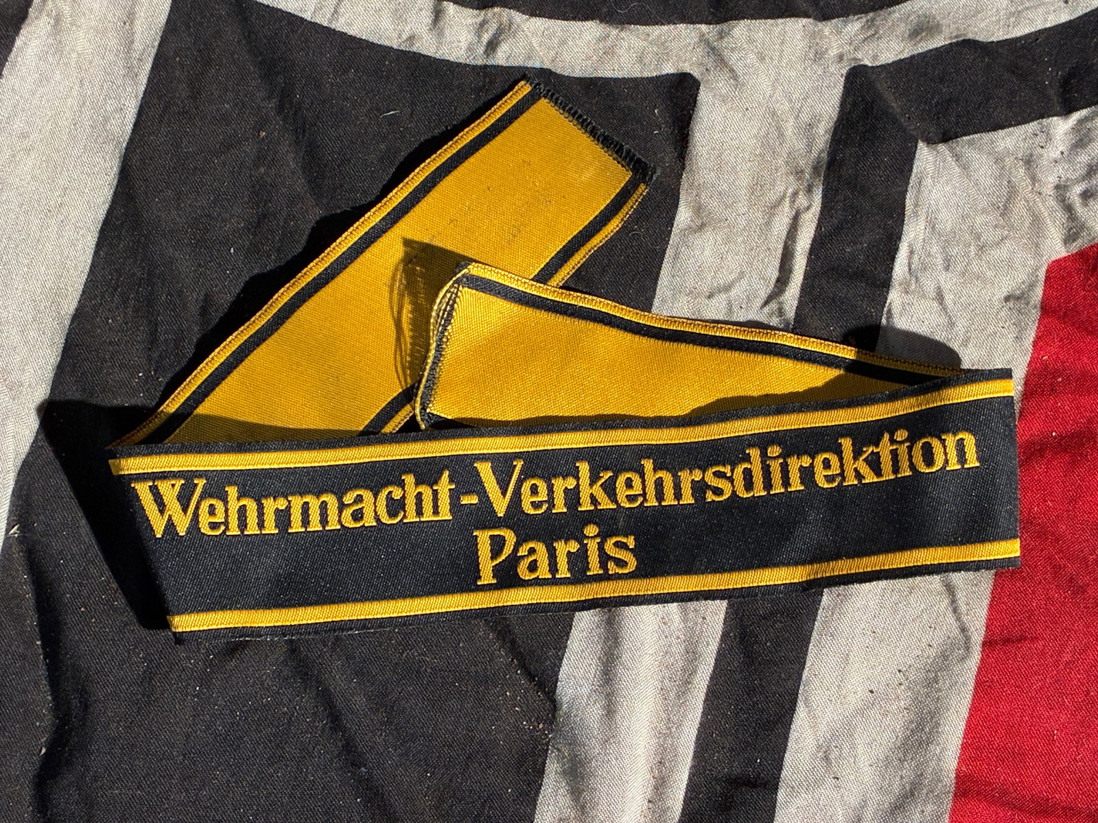 WW2 German Wehrmacht Traffic Directorate Armband — Paris (c. 1940–1944): This yellow-and-black woven armband was issued to personnel of the Wehrmacht-Verkehrsdirektion Paris—the German Army’s Traffic Directorate stationed in occupied Paris during the Second World War. 