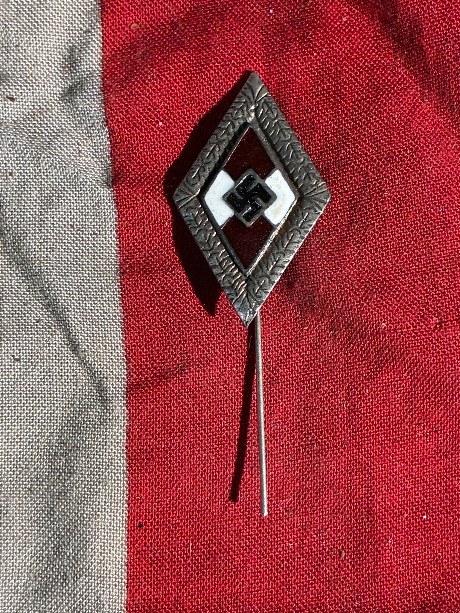 WW2 German Hitler Youth Membership Stickpin (HJ Mitgliedsabzeichen) – Early Pattern: This small diamond-shaped stickpin is an early form of the Hitlerjugend (Hitler Youth) membership badge, used during the 1930s by members of the Nazi Party’s official youth organization. The design 