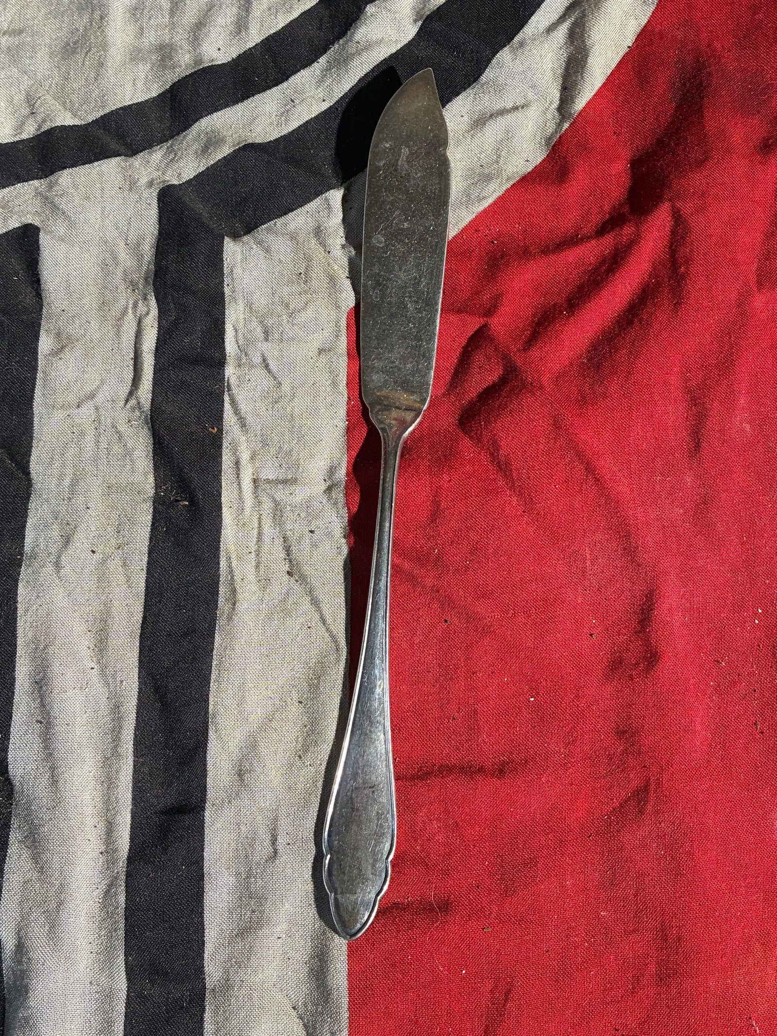 WW2 German Luftwaffe Table Knife (c. 1935–1945): This table knife, measuring approximately 8 inches in length, features a handle engraved with the stylized eagle-and-swastika emblem used by the German Luftwaffe during the Nazi era. Such pieces were 