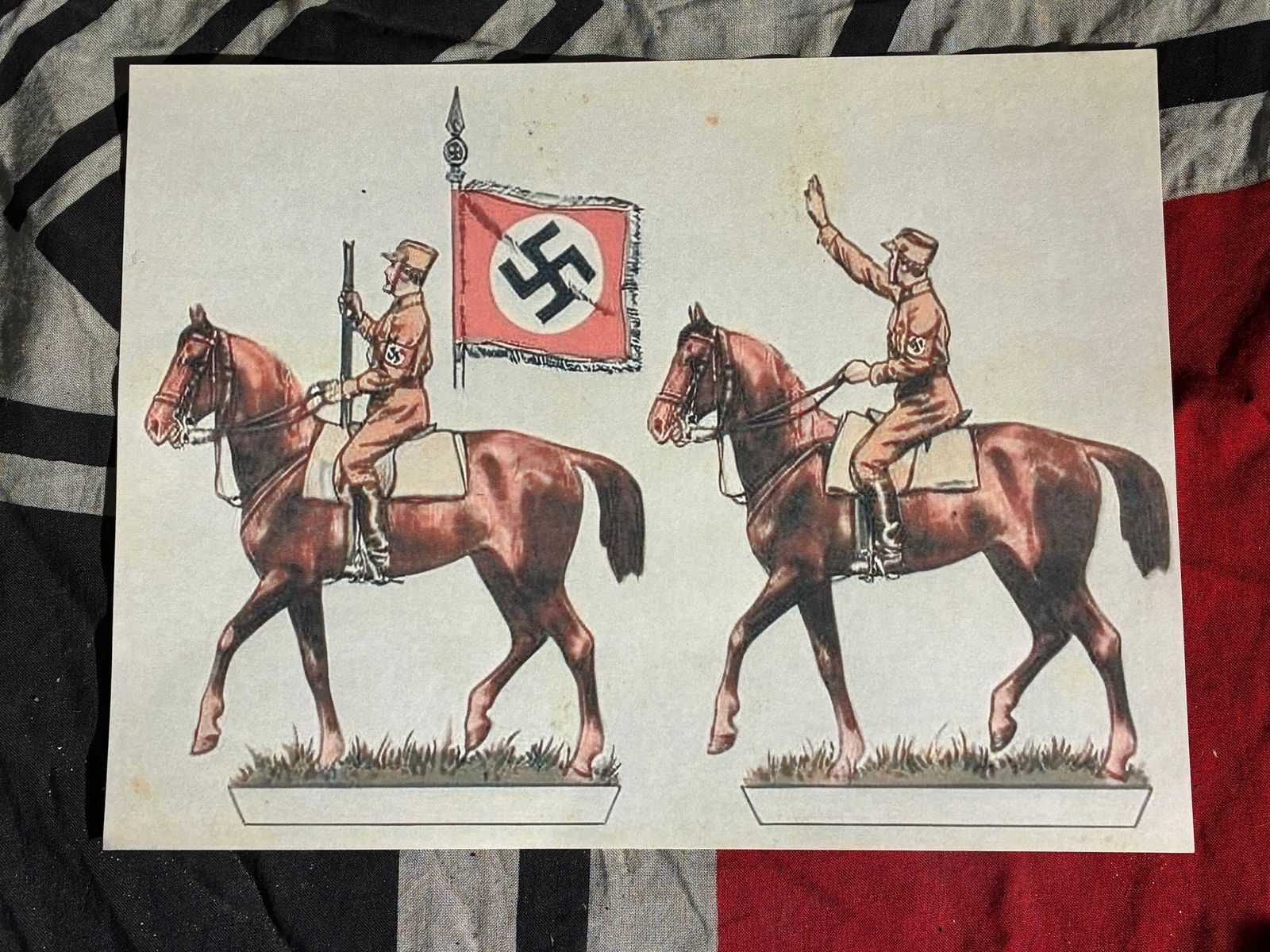 WW2 German Paramilitary Cavalry Illustration Sheet — Propaganda-Themed Cut-Out Ephemera (c.: This printed sheet depicts uniformed mounted figures affiliated with National Socialist paramilitary units, intended to be cut out and assembled as stand-up figures. Such illustrations were widely cir