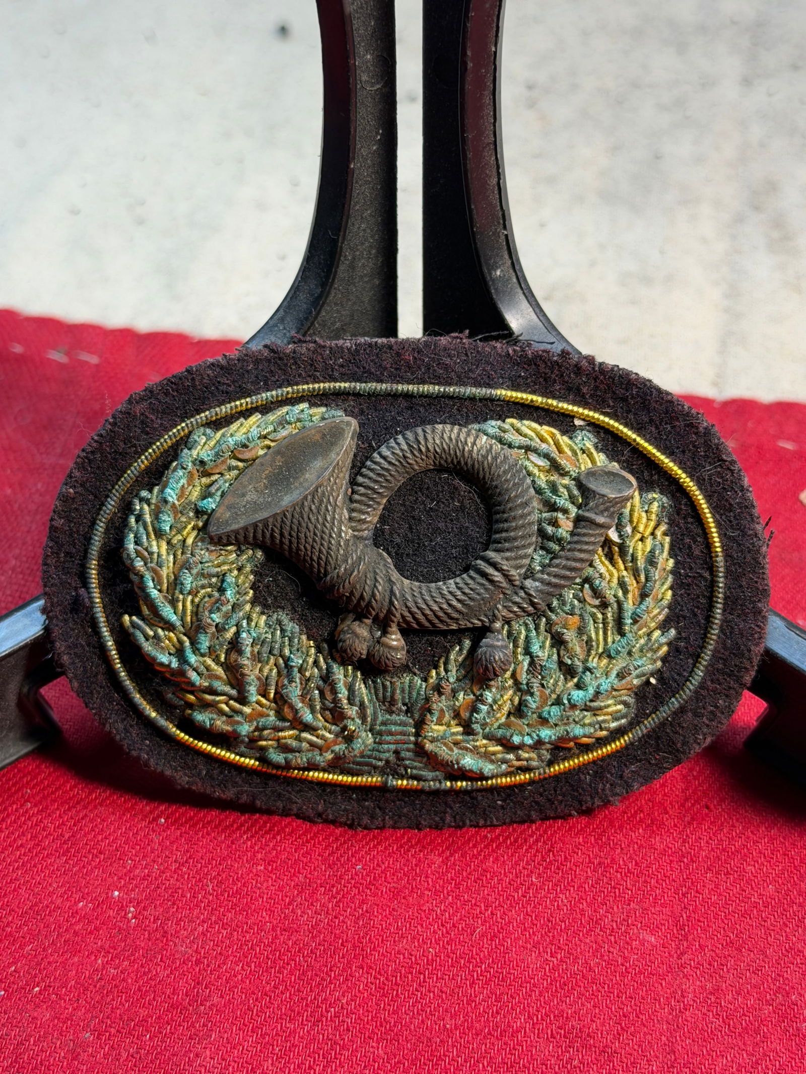 Civil War Infantry Hunting Horn Insignia — Schuyler, Hartley & Graham, New York: This embroidered insignia features a three-dimensional hunting horn surrounded by a laurel wreath, executed in metallic wire bullion on a dark wool backing. The hunting horn motif was widely used duri