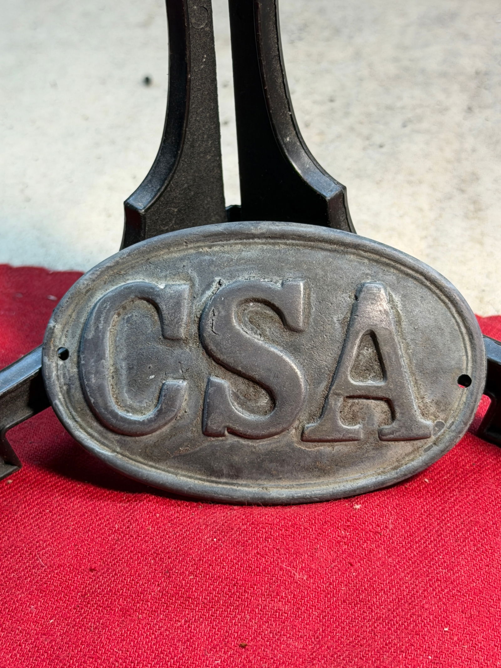 Civil War Confederate States Army (CSA) Cartridge Box Plate — 1861 Pattern: This cast-lead oval cartridge box plate, boldly embossed with the initials CSA, represents one of the most recognizable accoutrements carried by Confederate soldiers during the American Civil War. Mea