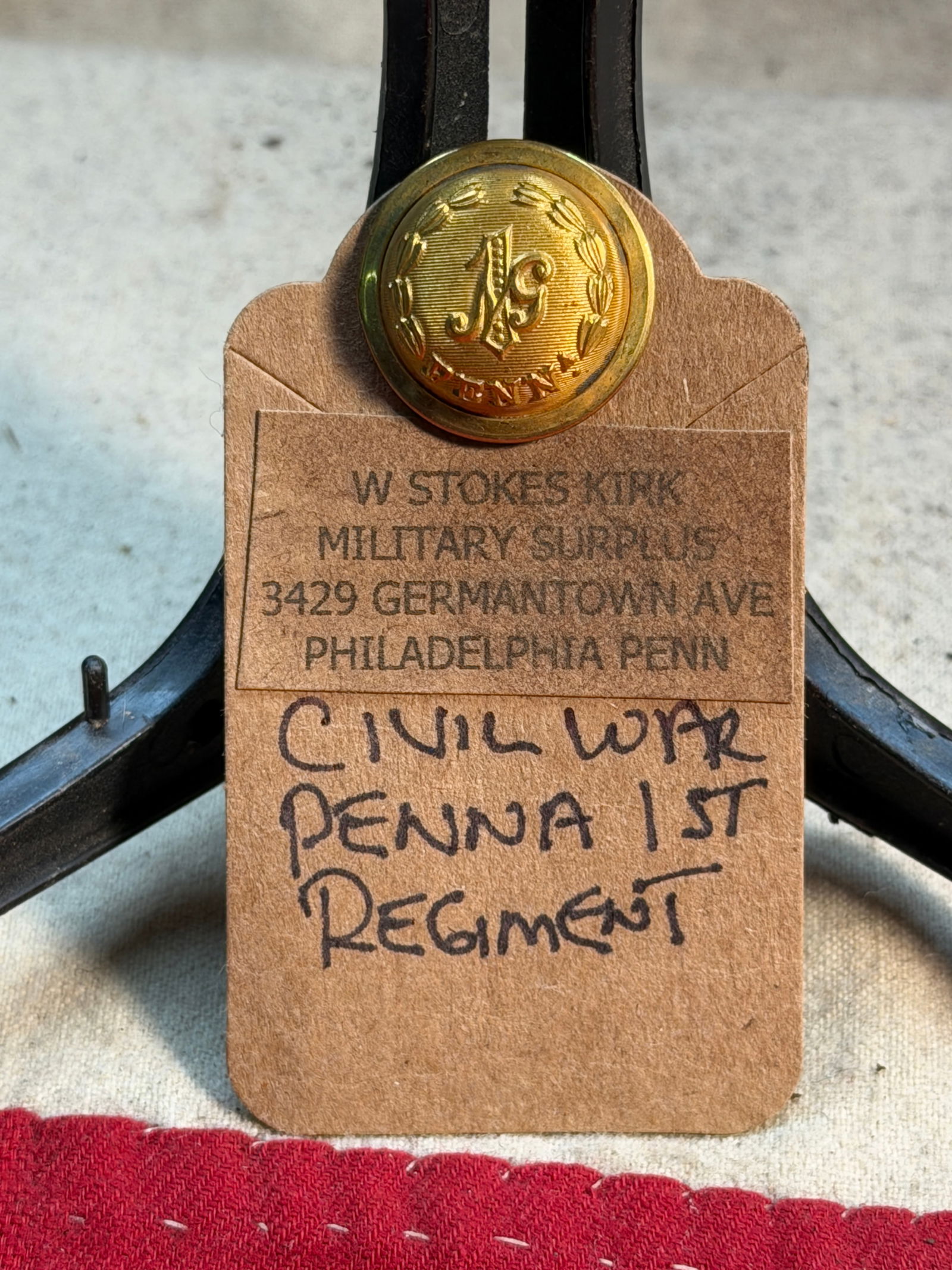 Civil War Pennsylvania 1st Regiment Brass Coat Button: This finely preserved Civil War–era brass coat button belonged to a soldier of the 1st Pennsylvania Regiment, one of the earliest volunteer units raised for Union service. The button features an ele