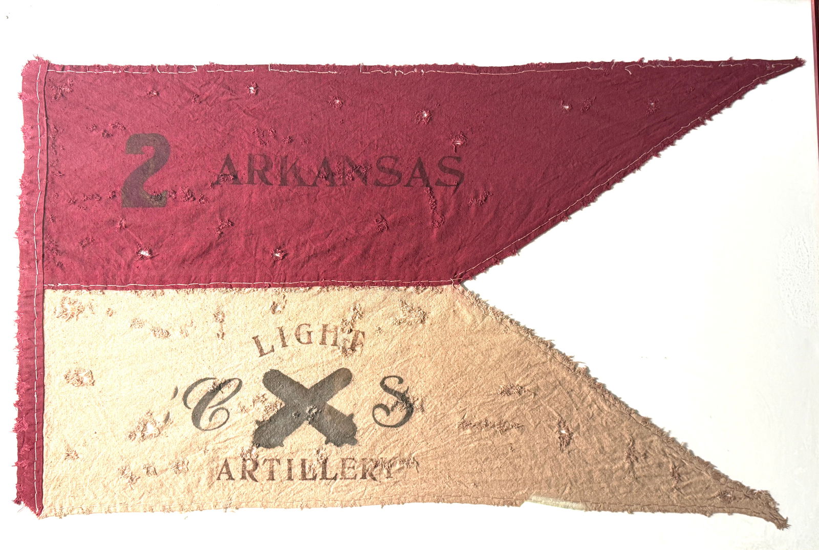 Civil War Confederate 2nd Arkansas Light Artillery Guidon Flag: This rare and battle-worn guidon belonged to the 2nd Arkansas Light Artillery, a Confederate unit active during the American Civil War. The swallowtail flag features its original two-color field: a de