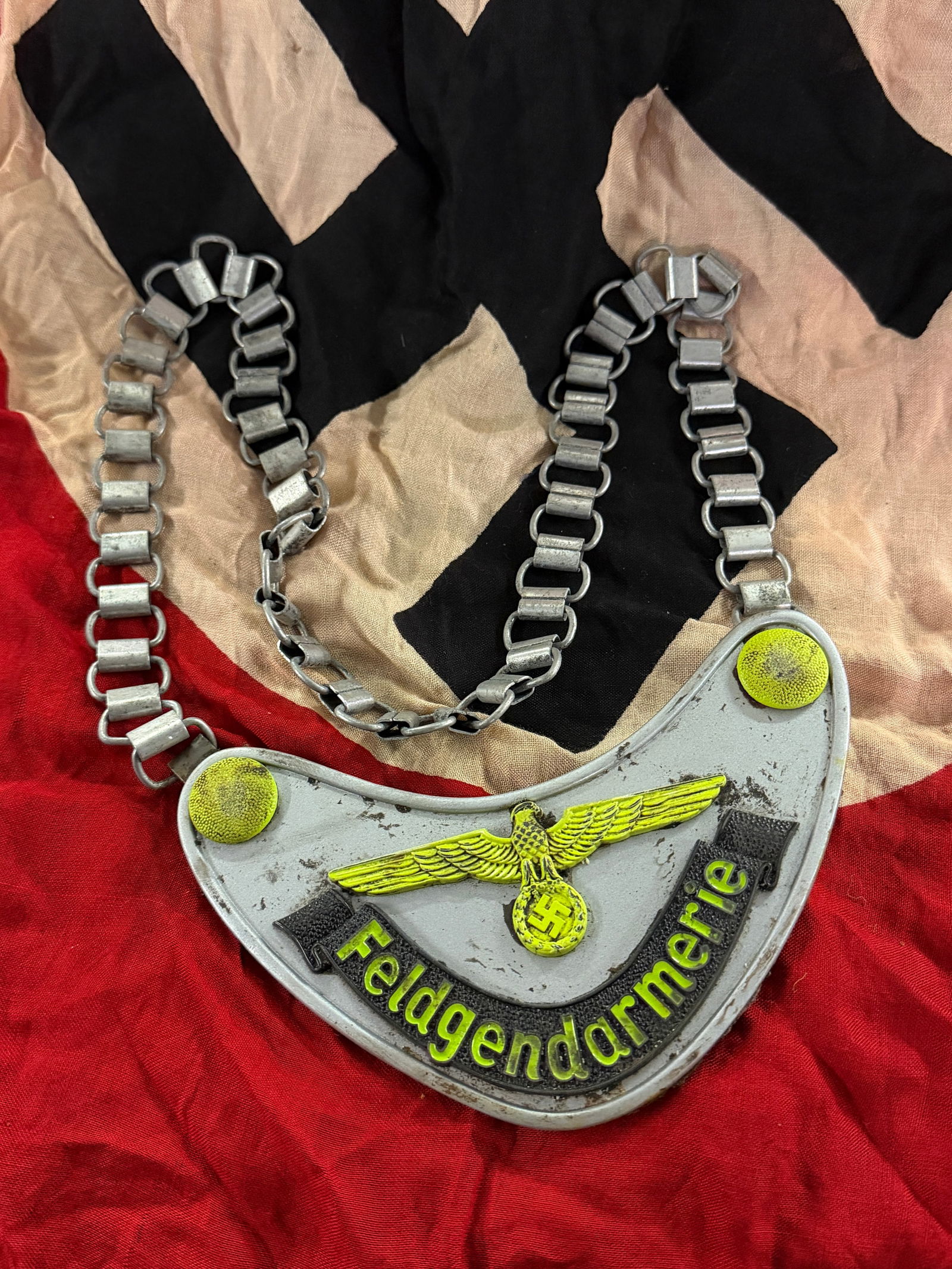 WW2 German Feldgendarmerie Gorget, Third Reich Period, ca. 1939–1945: This metal gorget was worn by members of the Feldgendarmerie, the military police branch of the German armed forces during the Second World War. Suspended from a linked metal chain and backed with fel