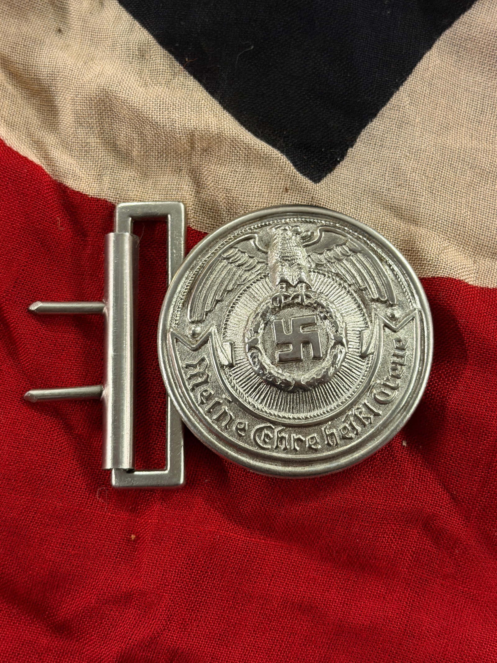 WW2 German Police Belt Buckle (“Meine Ehre heißt Treue??), Third Reich Period, ca. 1933–1945: This metal belt buckle was issued for wear by members of German police and affiliated uniformed organizations during the period of National Socialist rule in Germany. The circular buckle bears a styli