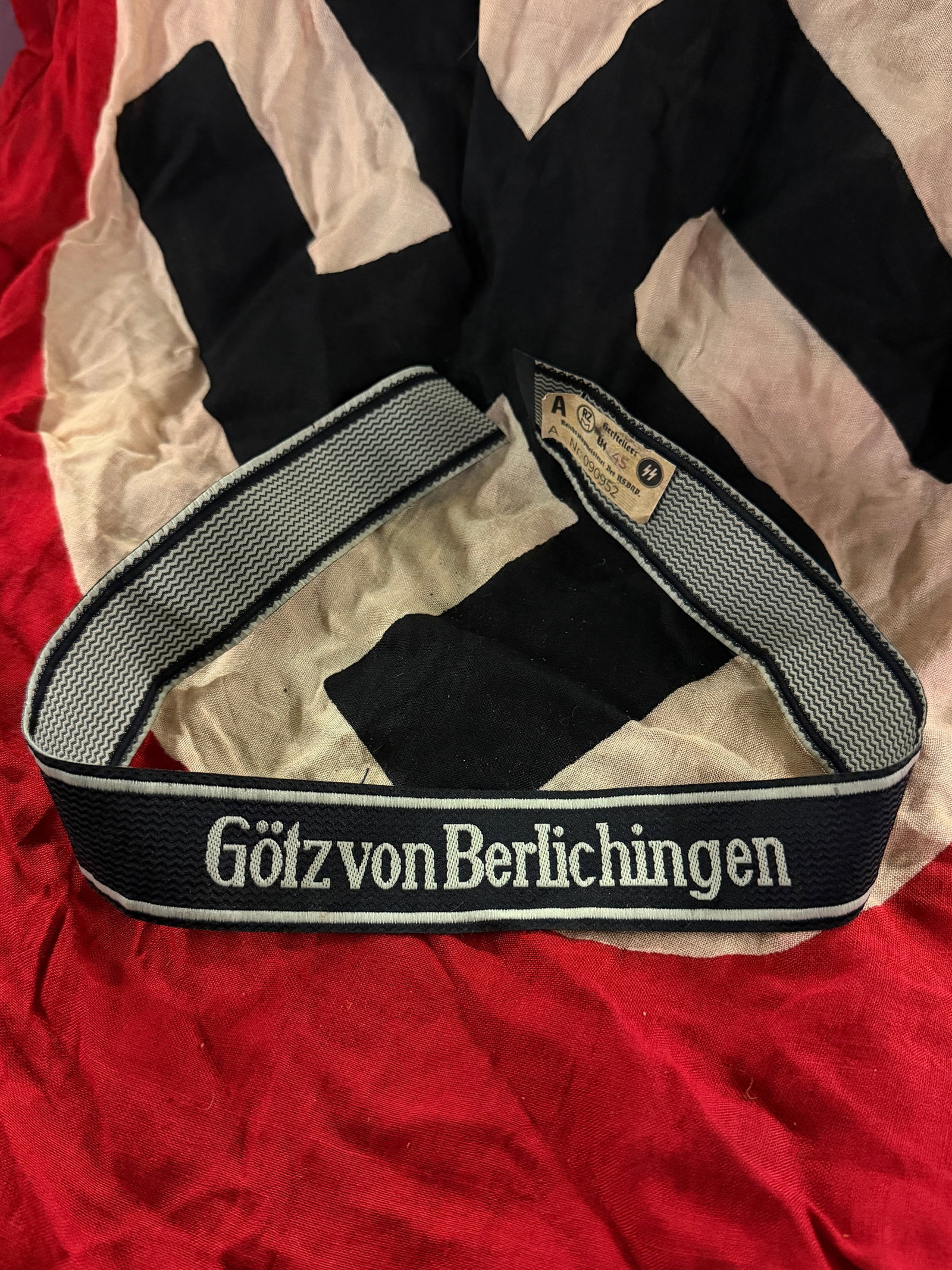 WW2 German Waffen-SS Cuff Title “Götz von Berlichingen?? with RZM Tag: This woven cuff title (Ärmelstreifen) bears the inscription “Götz von Berlichingen,” identifying the 17th SS Panzergrenadier Division “Götz von Berlichingen.” The unit, named after 