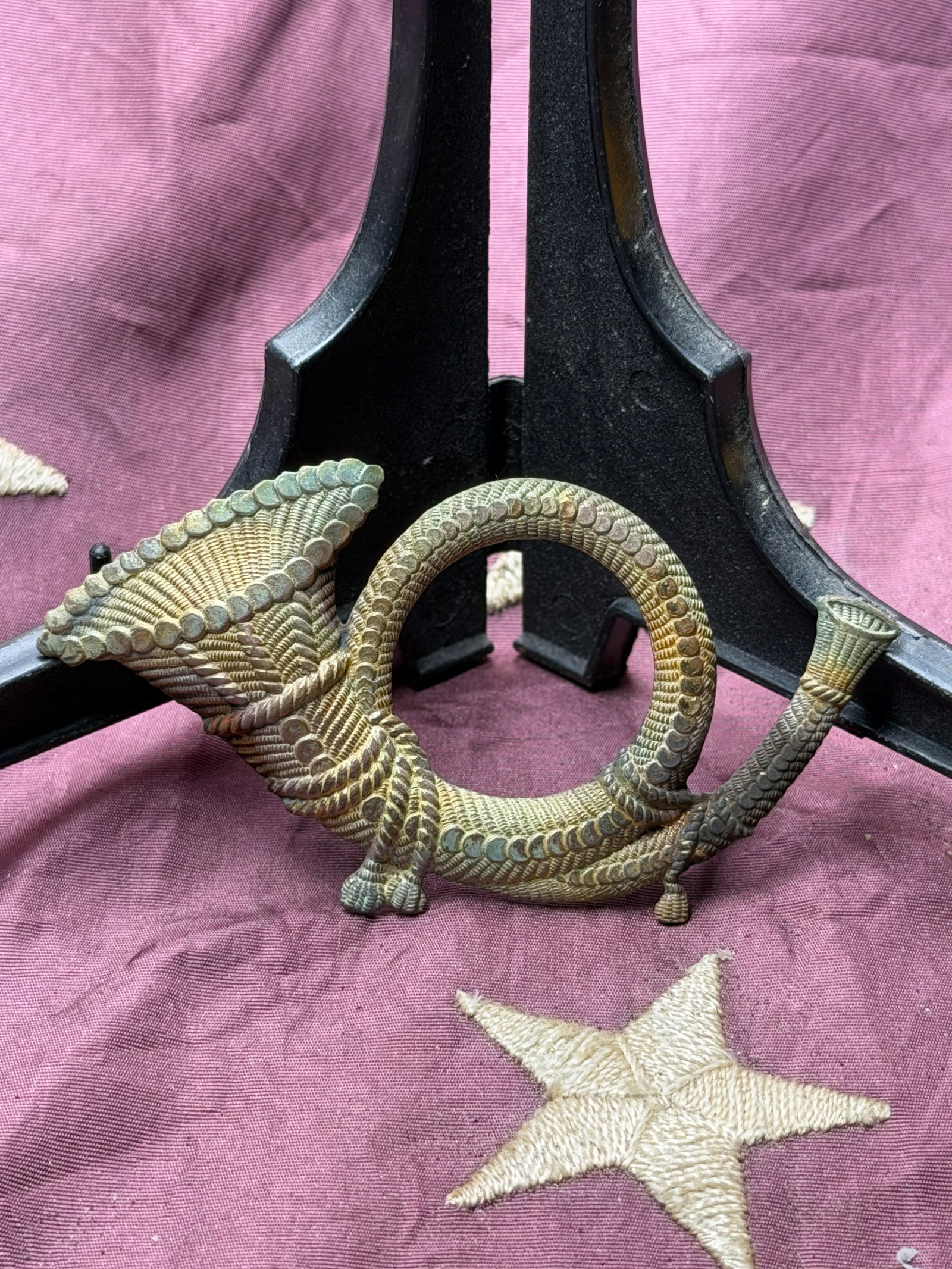 U.S. Army Model 1851 Infantry Officer’s Brass Hat Insignia: This cast brass hat insignia is identified as a Model 1851 U.S. Army Infantry officer’s device, depicting a circular infantry horn with decorative detailing. The infantry horn had been the establish