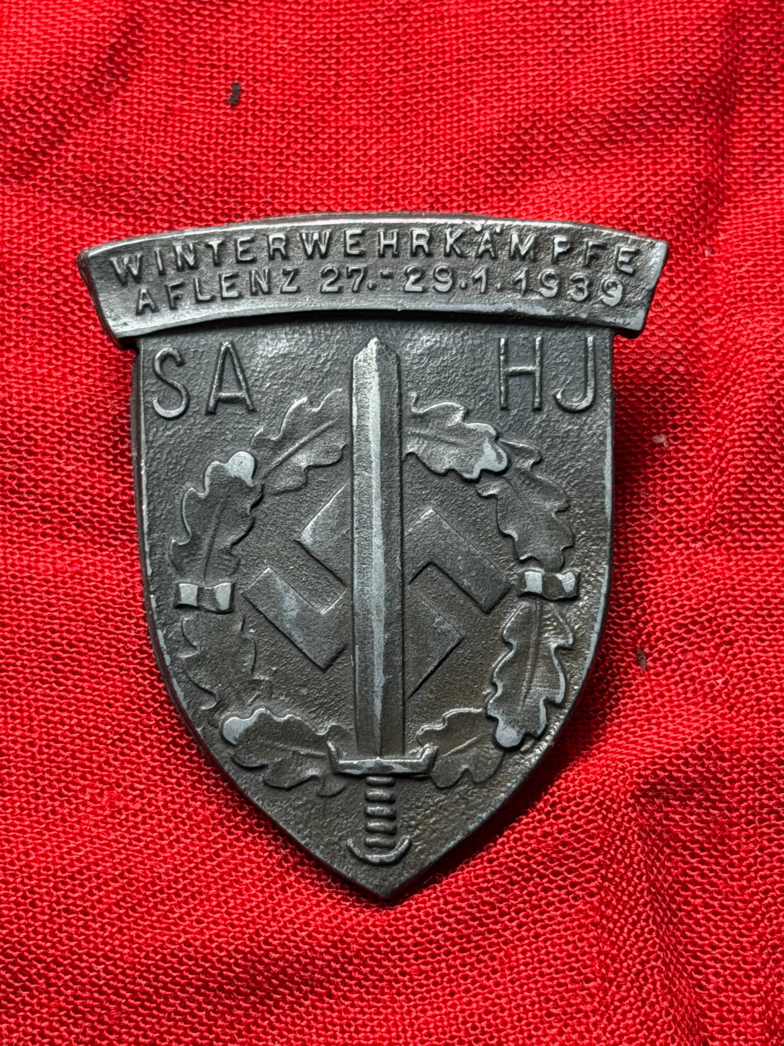WW2 German SA Winter Military Games Badge (Winterwehrkämpfe), Aflenz, January 1939: This badge was issued to participants in the Winterwehrkämpfe (Winter Military Games) held in Aflenz, Austria, from 27–29 January 1939. The event was organized by the Sturmabteilung (SA), a paramil
