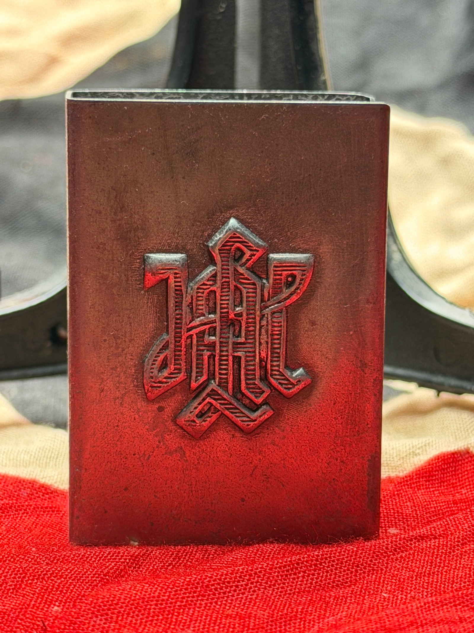 WW2 German Cigarette Case with DRP Monogram: This metal cigarette case bears a raised “DRP” monogram on the front. The initials stand for Deutsches Reichspatent, indicating a registered design or patented industrial product within German