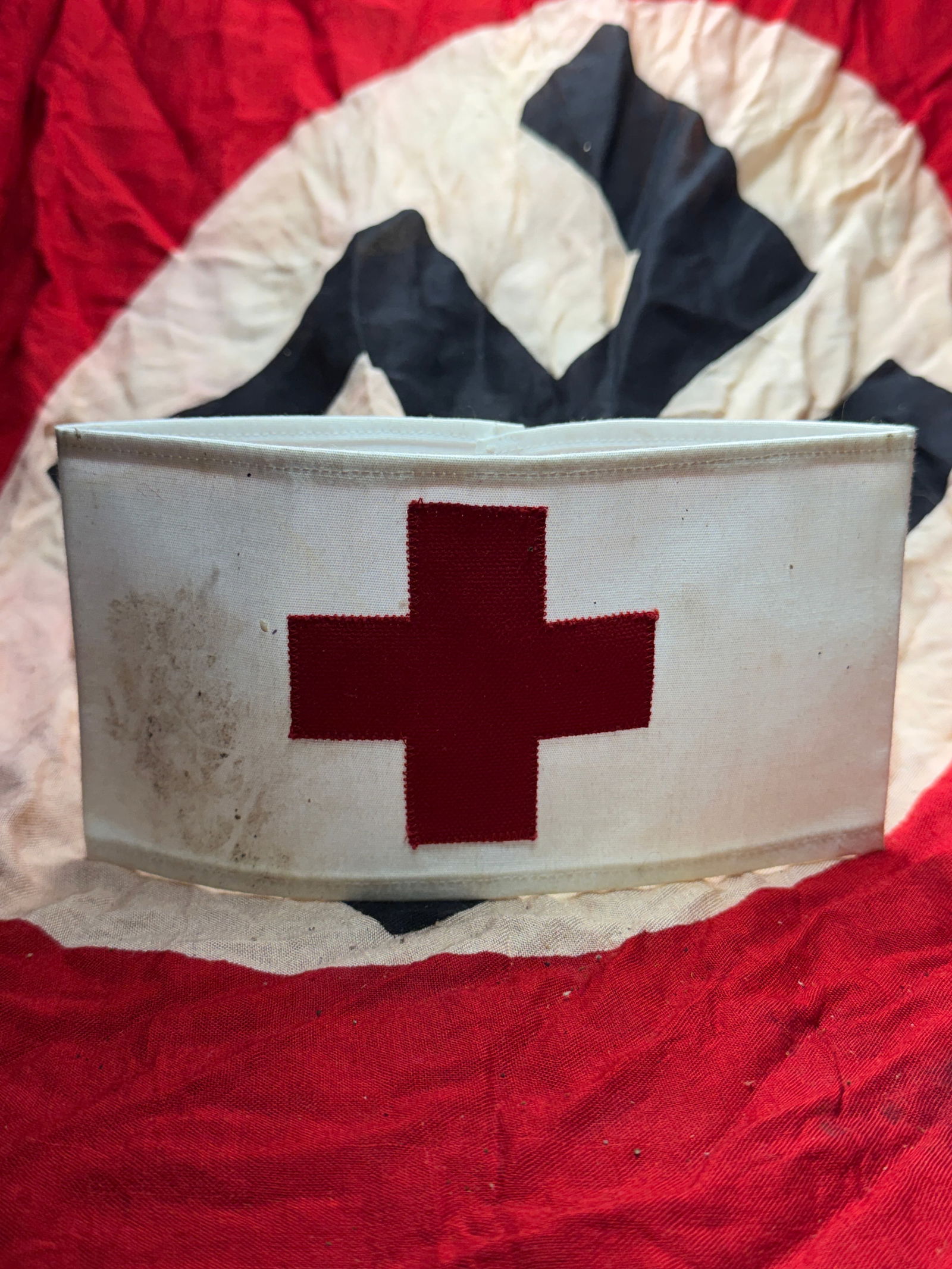 WW2 German Red Cross (Deutsches Rotes Kreuz) Medical Armband: German Red Cross (Deutsches Rotes Kreuz, DRK) armband was worn during the Second World War to identify medical and humanitarian personnel. Constructed from white cotton fabric and bearing a sewn red c