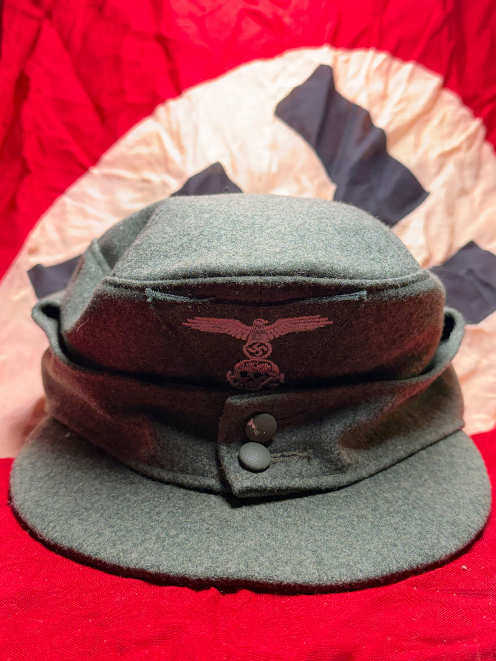 WW2 German Army Field Cap (Einheitsfeldmütze), World War II: This wool field cap was worn by soldiers of the German Army (Heer) during World War II. Introduced as a practical replacement for earlier headgear, the Einheitsfeldmütze was designed for use in both