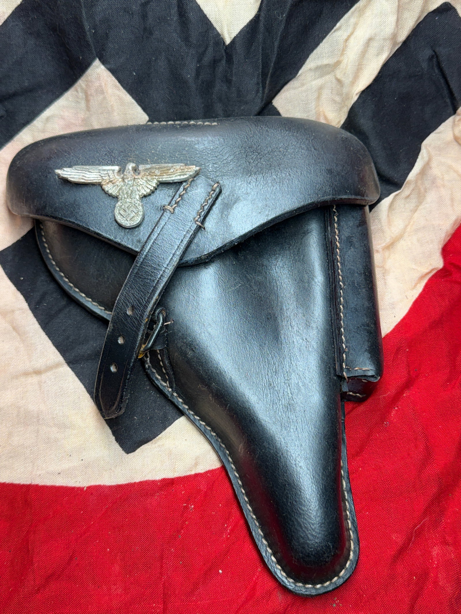 WW2 German Holster for P08 Luger Pistol: This black leather holster was manufactured in 1941 for the P08 Luger pistol, the standard German sidearm during the Second World War. The interior is stamped “E. G. Leuner GmbH, Bautzen, 1941&rdquo