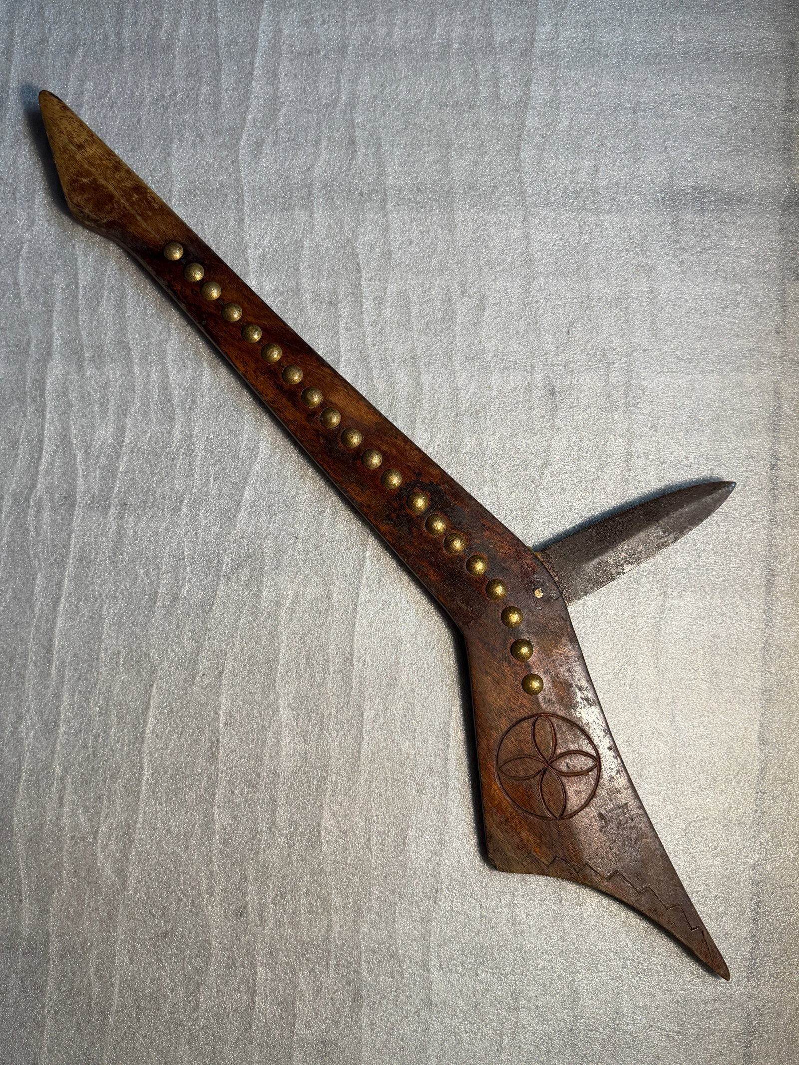 Gunstock War Club, Native American, Eastern Woodlands, 19th Century: This gunstock war club is a striking example of an Indigenous weapon form developed in the Eastern Woodlands during the 18th and 19th centuries. Carved from a single piece of hardwood, the club takes 