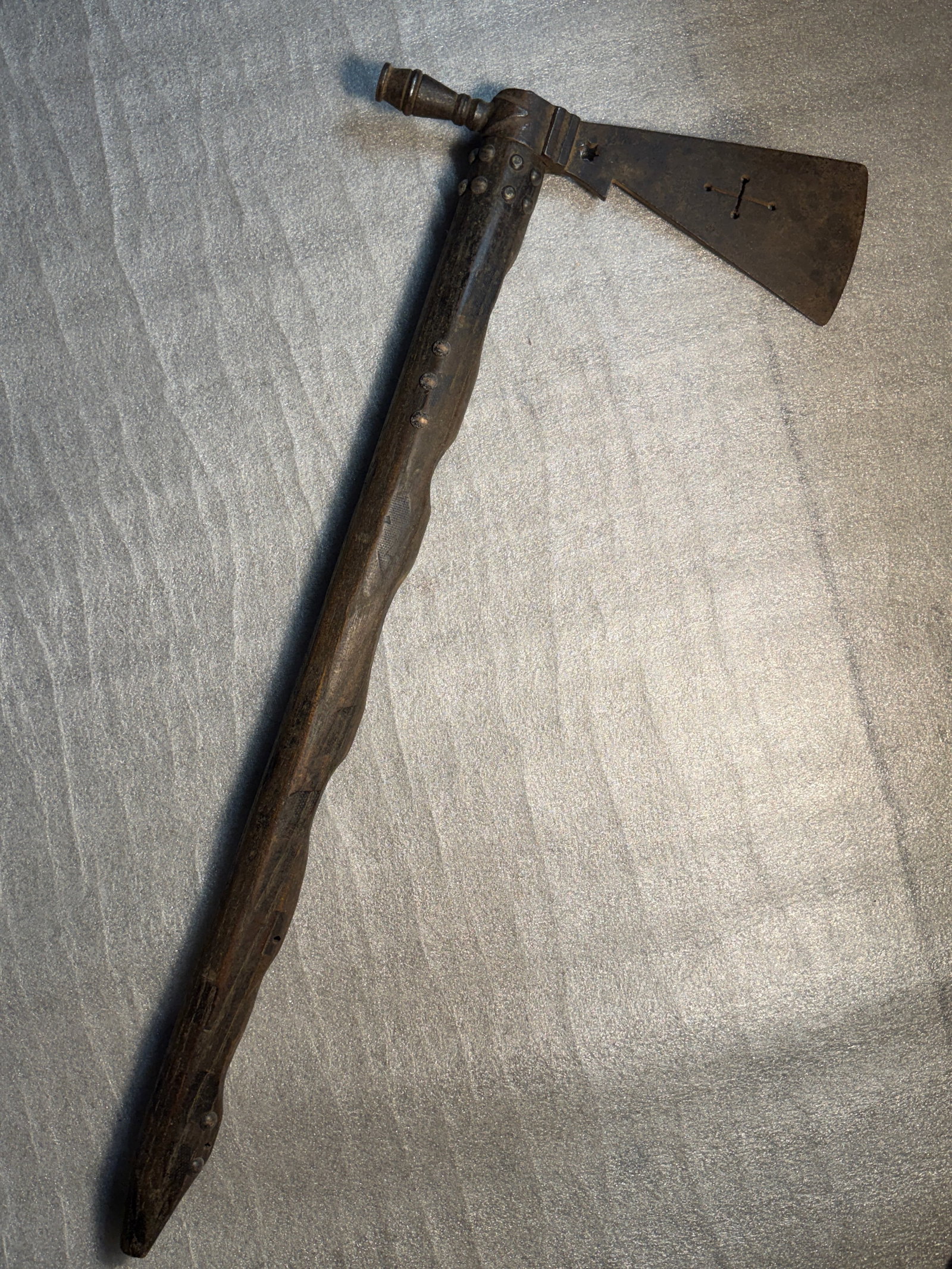 Pipe Tomahawk, Used by Navajo (Diné) Peoples, American Southwest, Mid–Late 19th Century: This pipe tomahawk is an important example of a multifunctional object used by the Navajo (Diné) during the mid to late 19th century, reflecting the complex blending of Indigenous tradition and intro