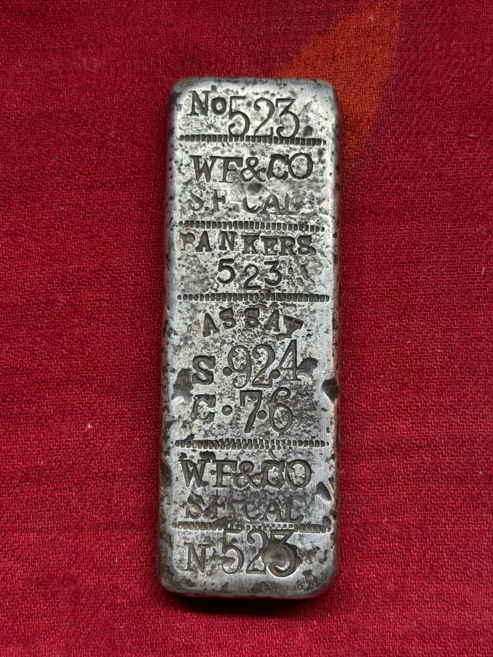 1870's Wells Fargo 6.20 ozt .924 Pure Silver Bar Ingot With Inspection Markings: This silver ingot, commonly referred to as a “banker bar,” represents the material foundations of commerce in the American West during the late nineteenth century. Cast and stamped by Wells, F