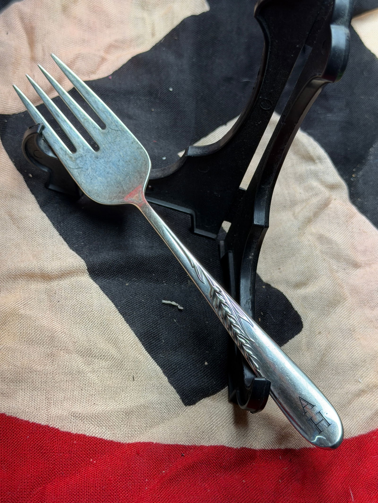 WW2 German Monogrammed Silver Table Fork Attributed to Adolf Hitler: This silver-plated table fork bears the engraved initials “A.H.” on the handle, a monogram widely documented on personal tableware associated with Adolf Hitler and the Nazi leadership. The for