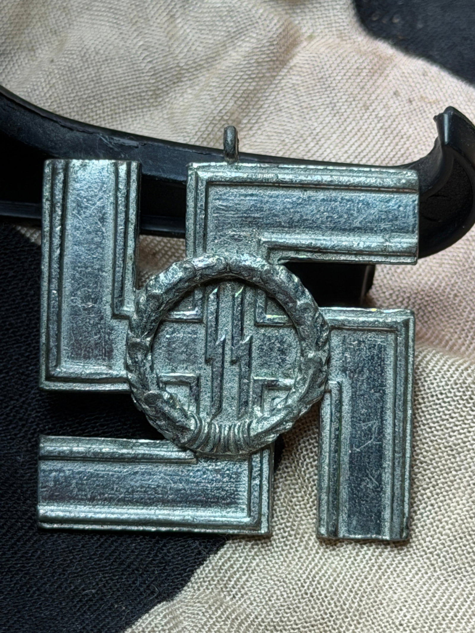 WW2 German Third Reich Political Badge: “Treue Dienste in der SS?? (Loyal Service in the SS): This metal political badge dates to the period of National Socialist rule in Germany (1933–1945) and bears the inscription “Treue Dienste in der SS”, translating to “Loyal Service in the S