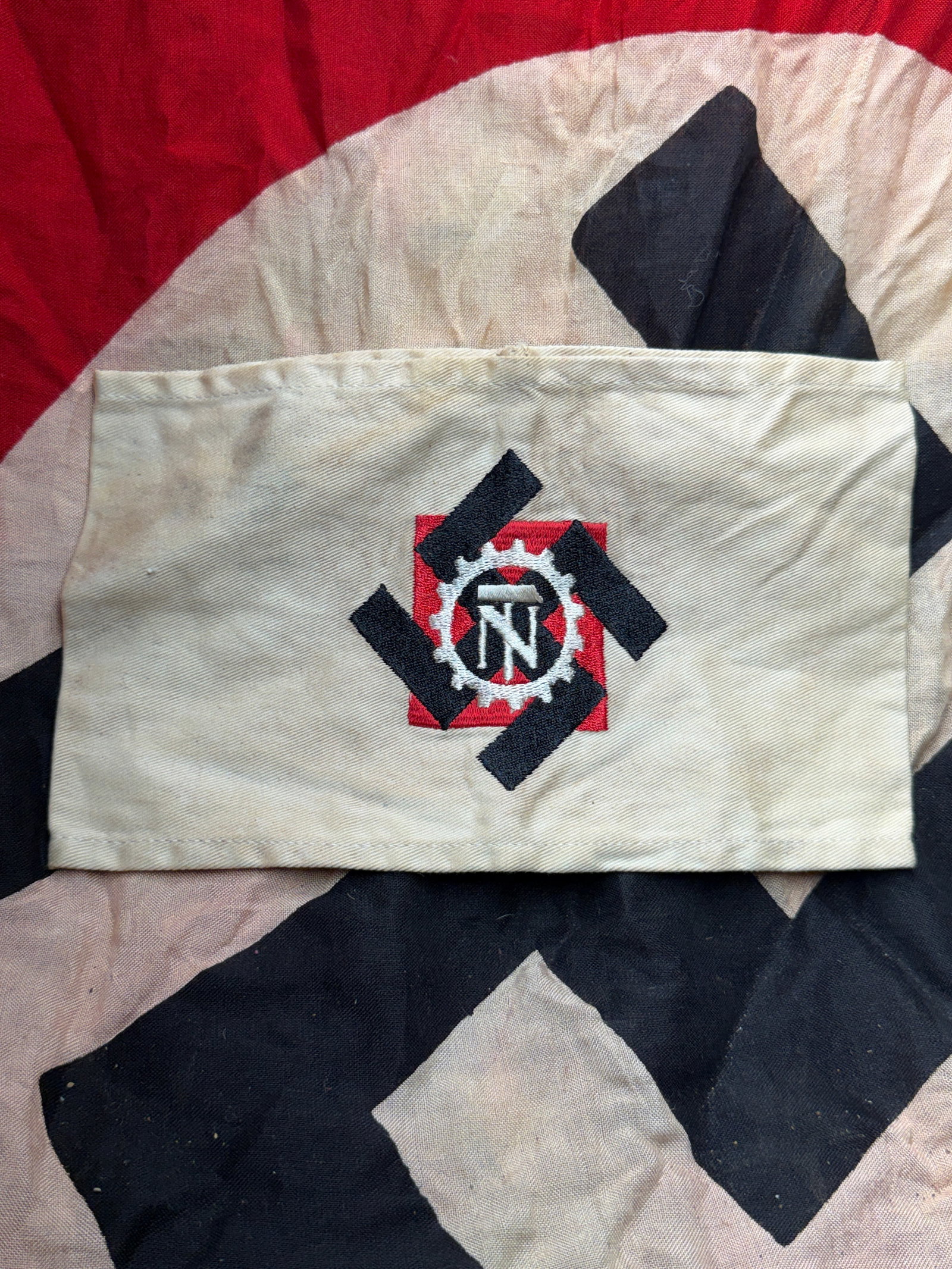 WW2 German Armband of the National Socialist Factory Cell Organization (NSBO), Germany, c.: This armband bears the emblem of the National Socialist Factory Cell Organization (Nationalsozialistische Betriebszellenorganisation, NSBO), a labor organization affiliated with the Nazi Party in Germ