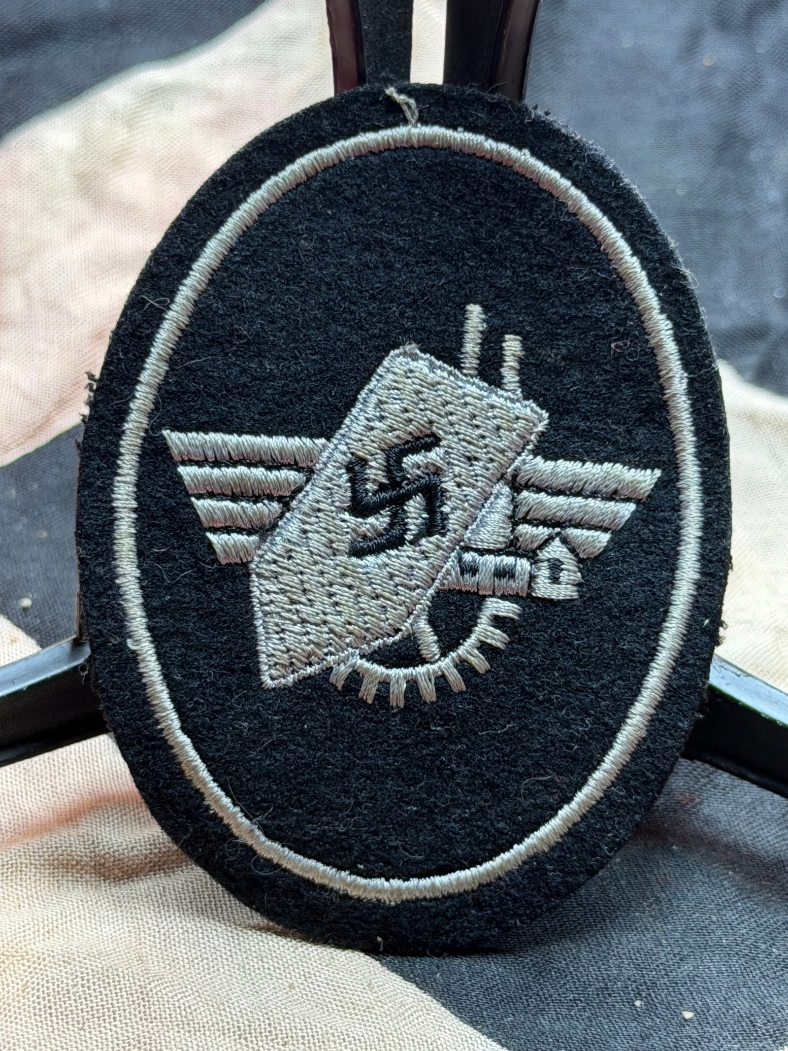 WW2 German Werkschutz (Factory Guard) Sleeve Insignia: This embroidered cloth insignia is associated with the Werkschutz, the industrial Factory Guard units operating in Nazi Germany during the Second World War. Werkschutz formations were responsible for 