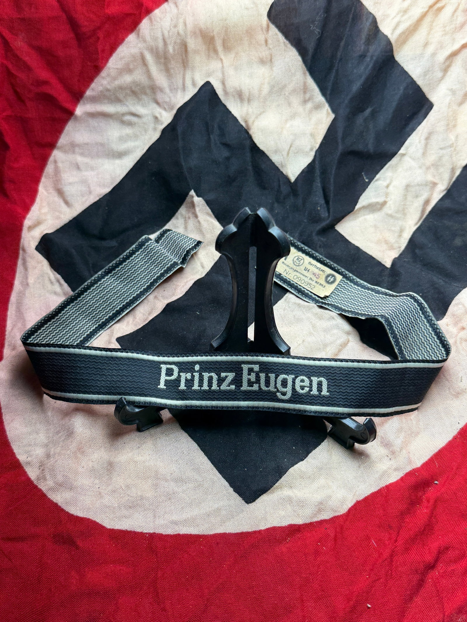 WW2 German Waffen-SS Cuff Title “Prinz Eugen: This woven cuff title, bearing the inscription “Prinz Eugen,” was worn on the lower sleeve of uniforms issued to members of the 7th SS Volunteer Mountain Division “Prinz Eugen.” Raised