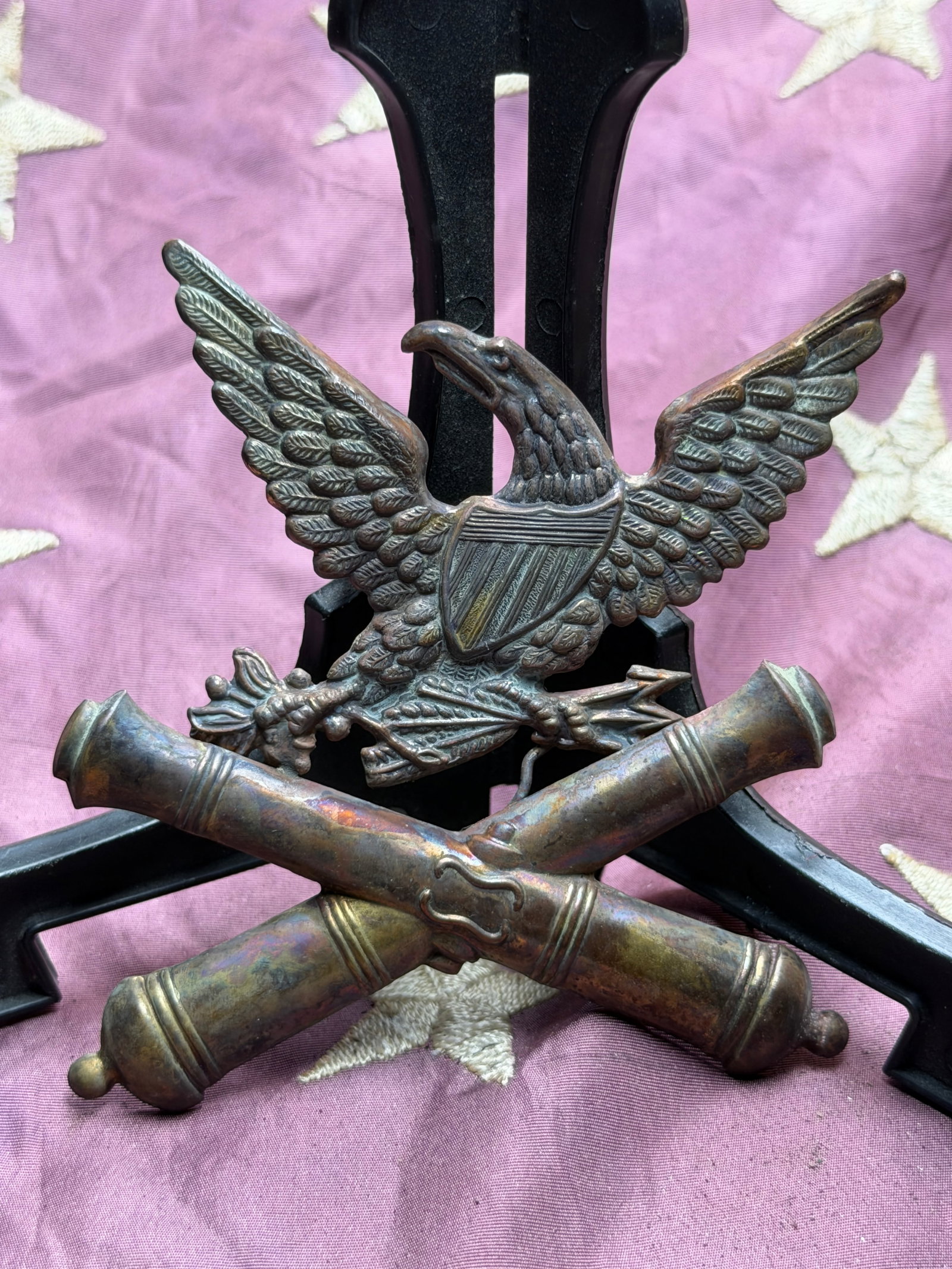 Civil War United States Marine Corps Artillery Insignia (Crossed Cannons with Eagle): This metal insignia represents a rare Civil War–era United States Marine Corps (USMC) artillery device, combining the national eagle with crossed cannons—an emblem long associated with artillery s