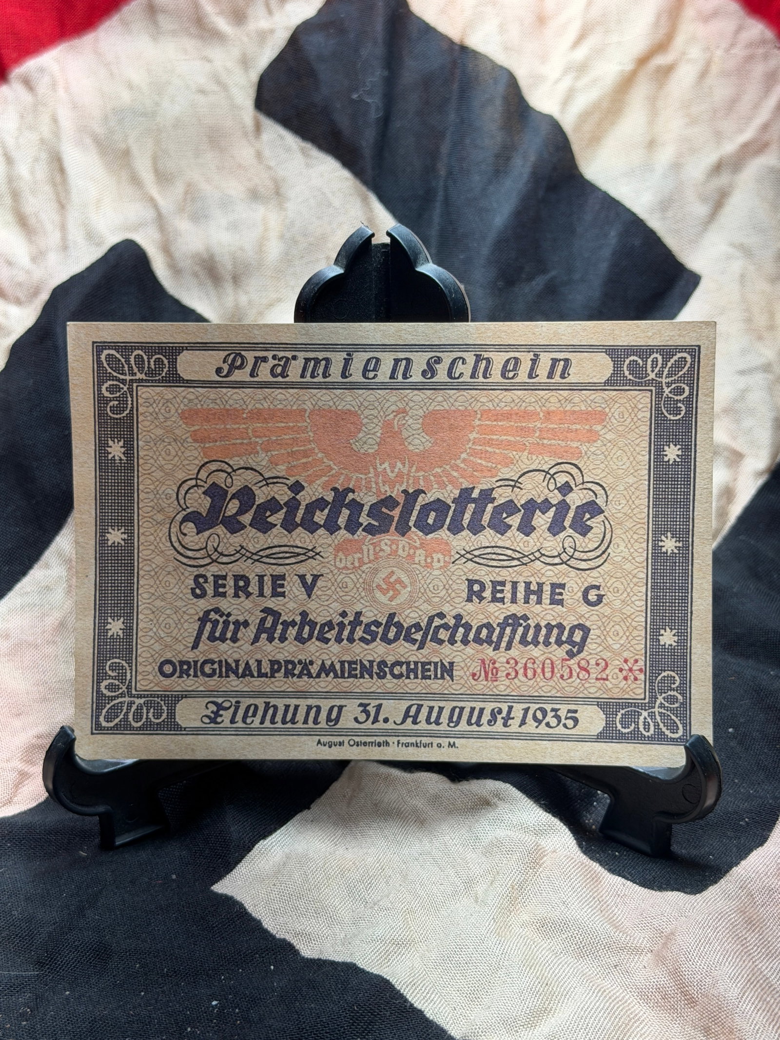 WW2 German Reich Lottery Prize Certificate (Reichslotterie Prämienschein): This Reichslotterie prize certificate dates to 31 August 1935 and represents a financial and propagandistic instrument of Nazi Germany. Issued under Series V, Row G, the certificate was part of the Re
