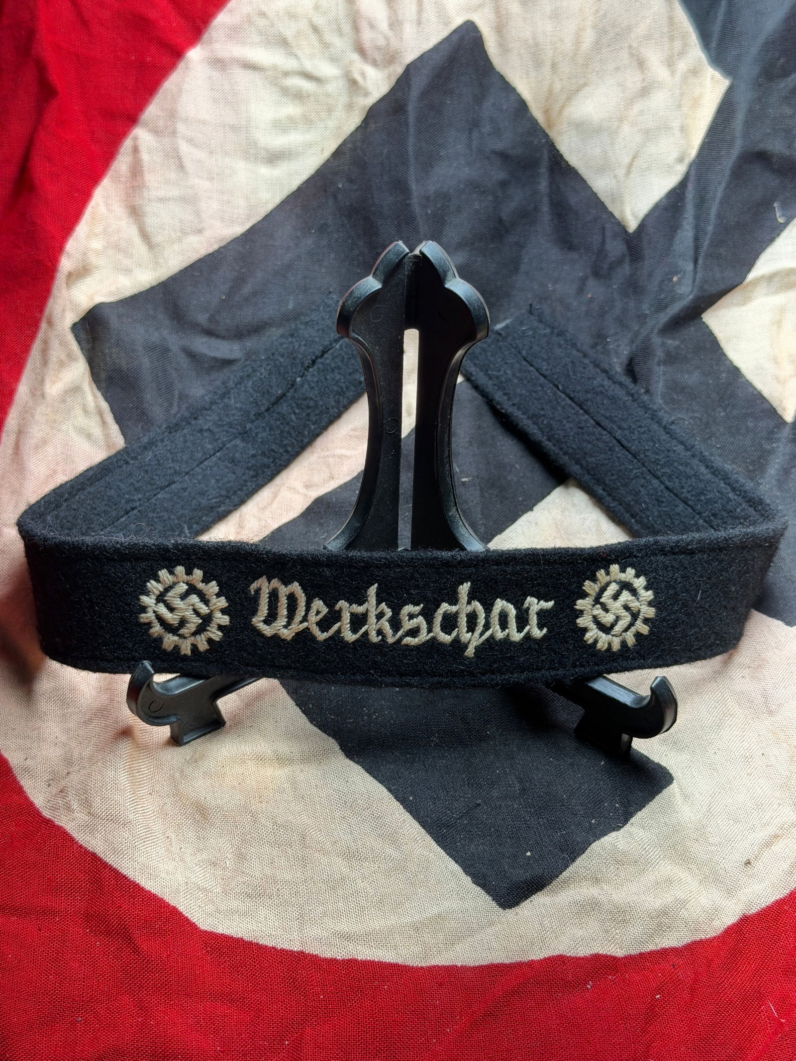 WW2 German “Werkschar?? Cuff Title (Ärmelstreifen): This embroidered black wool cuff title bears the inscription “Werkschar”, flanked by National Socialist emblems, and was worn on the lower sleeve of uniforms associated with early Nazi labor a