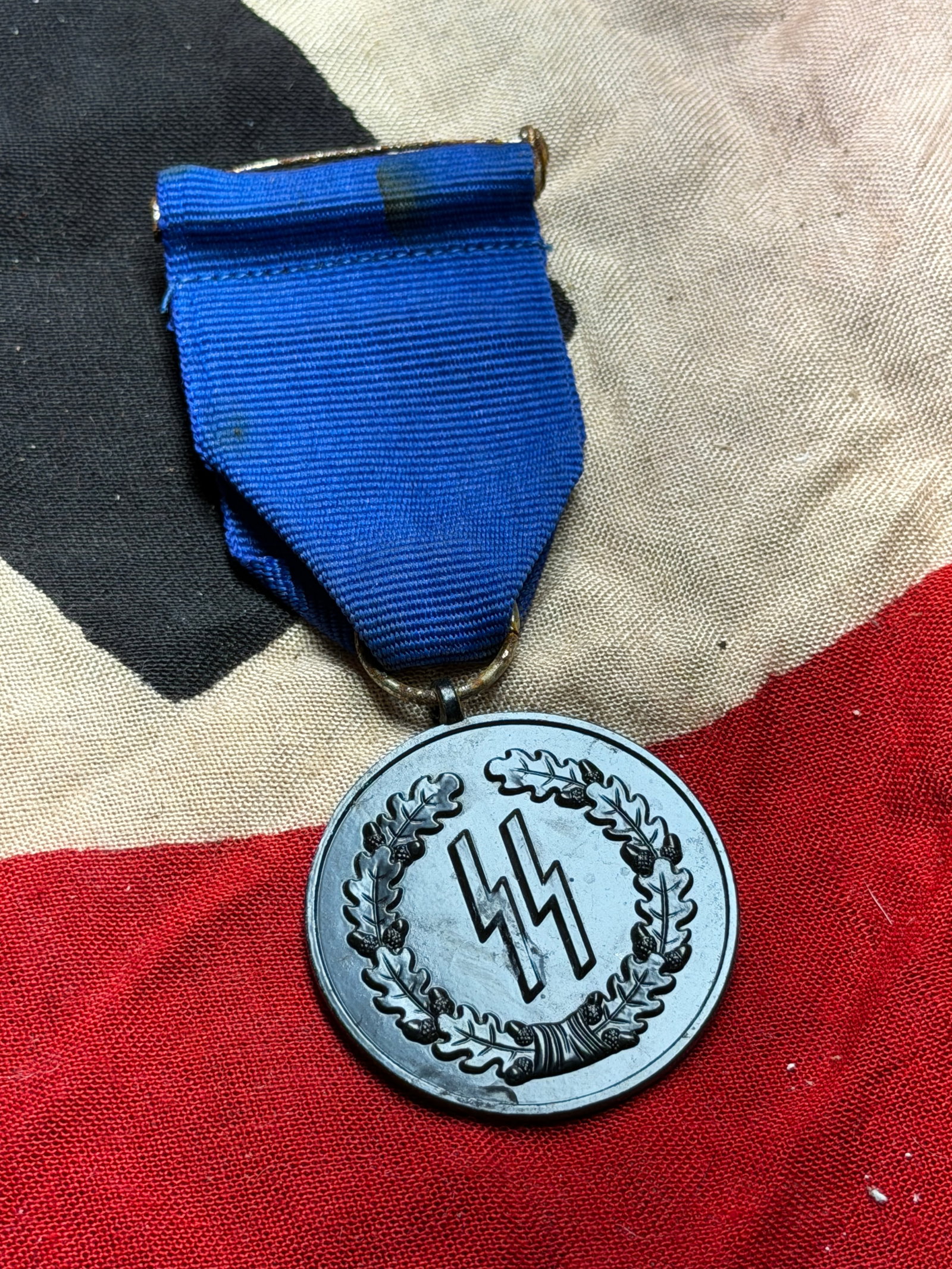 WW2 German SS Long Service Award, 4th Class (Treue Dienste), Nazi Germany: This medal is a Fourth Class SS Long Service Award, instituted in 1938 by the Nazi regime to recognize sustained service within the Schutzstaffel (SS). Awarded after four years of service, it formed t