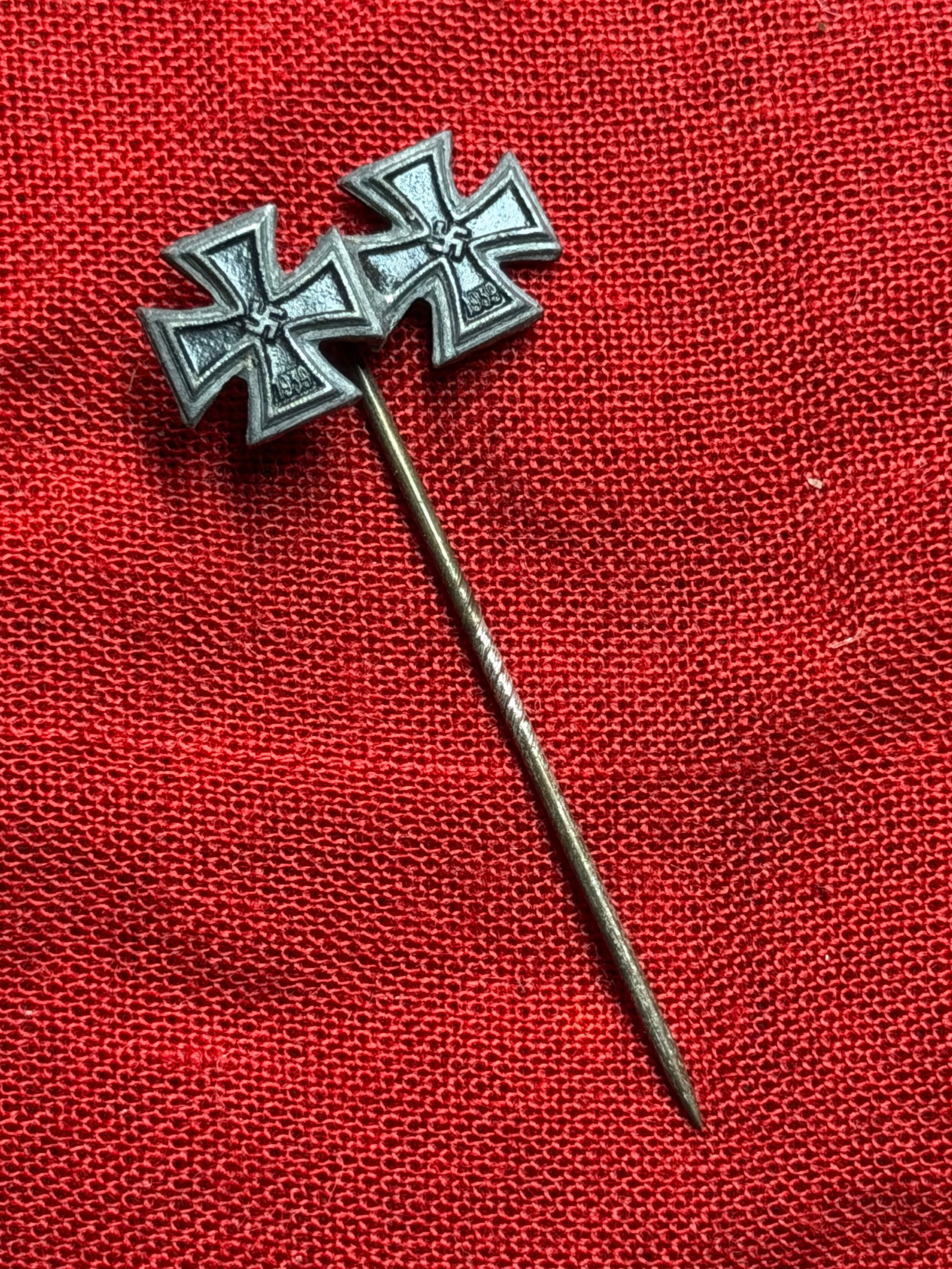 WW2 German Iron Cross First and Second Class Miniature Stickpin: This miniature stickpin combines representations of both the Iron Cross First Class and Iron Cross Second Class (1939 pattern), rendered in reduced scale for civilian wear. Such stickpins were private