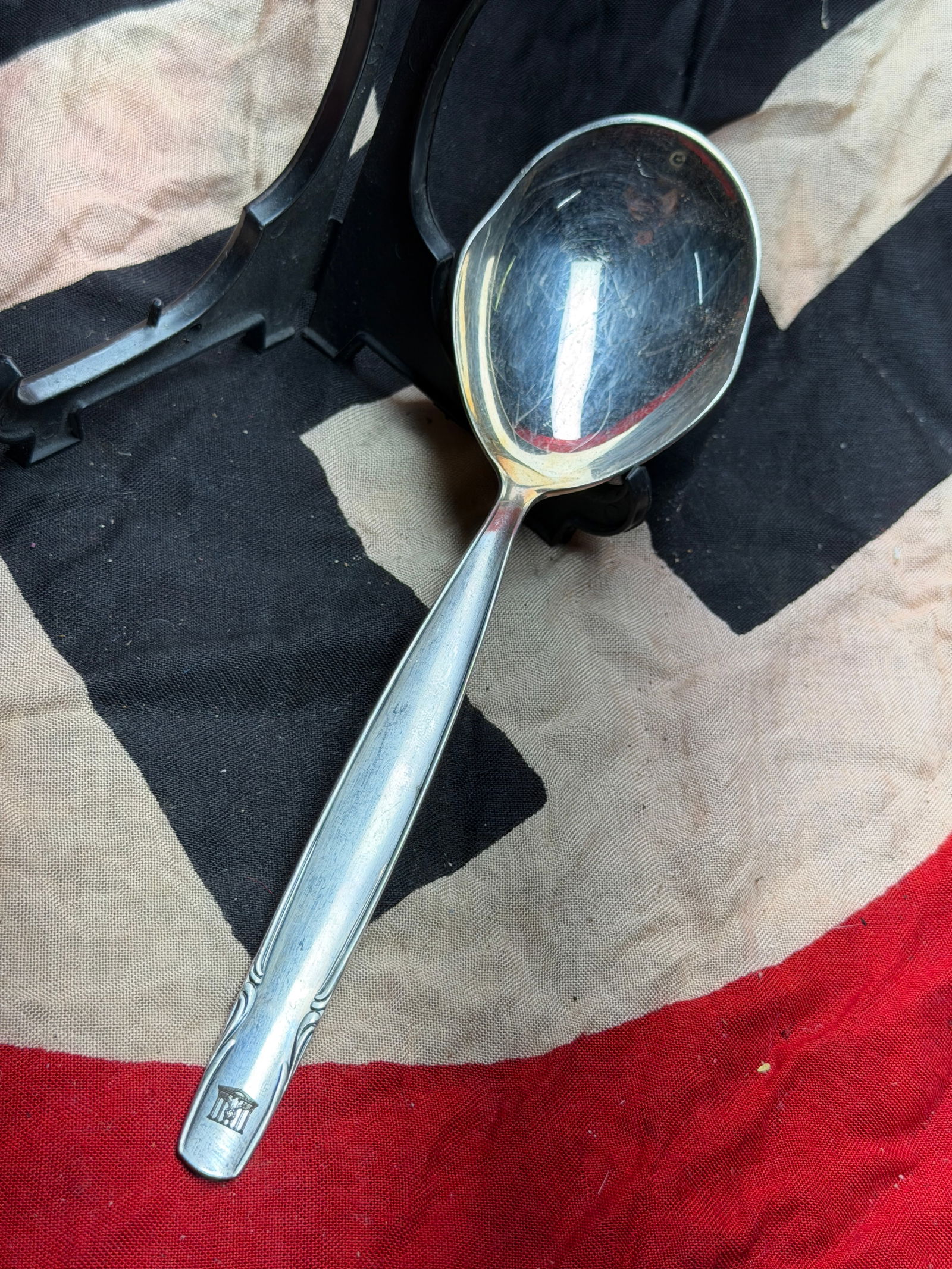 WW2 German State Silver Serving Spoon with Reich Chancellery Mark: This silver serving spoon is a formally produced piece of German state tableware dating to the period of the Third Reich (1933–1945). The handle bears a stamped emblem depicting the Reich Chanceller