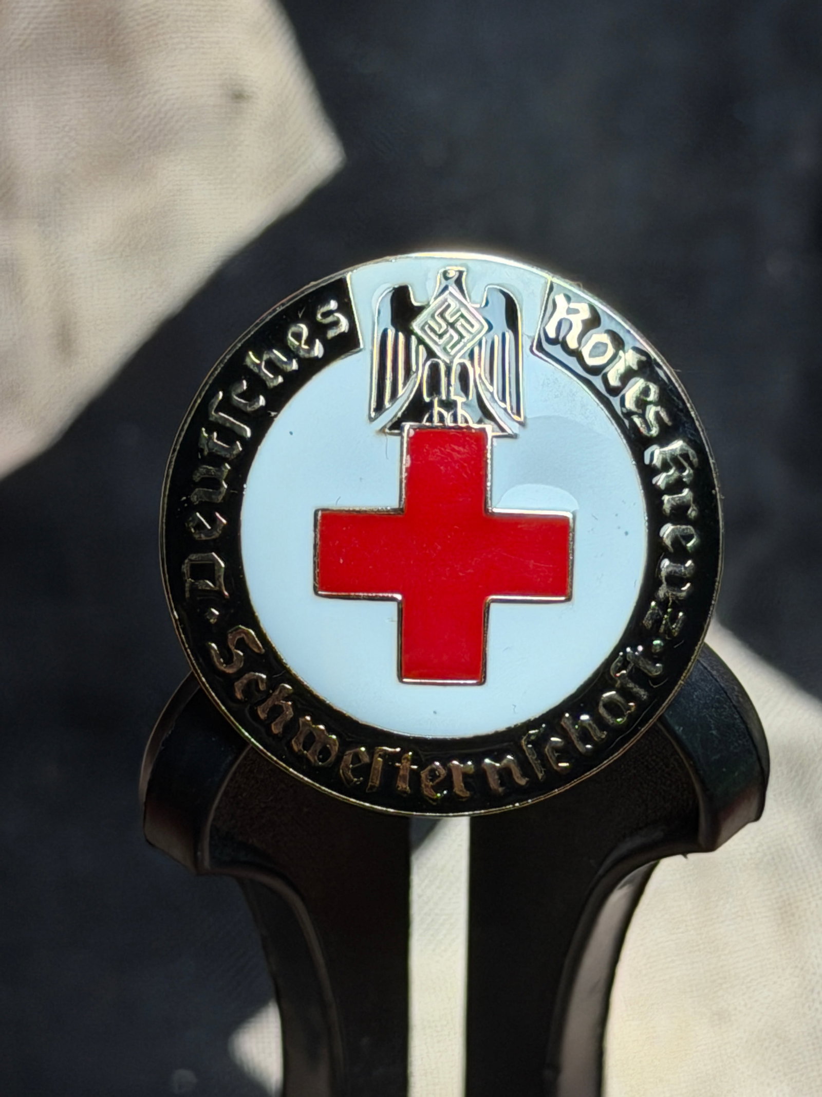 WW2 German Red Cross (Deutsches Rotes Kreuz) Membership Badge, Third Reich Period: This circular enamel badge represents membership in the German Red Cross (Deutsches Rotes Kreuz, DRK) during the National Socialist era (1933–1945). The central red cross on a white field—an inter