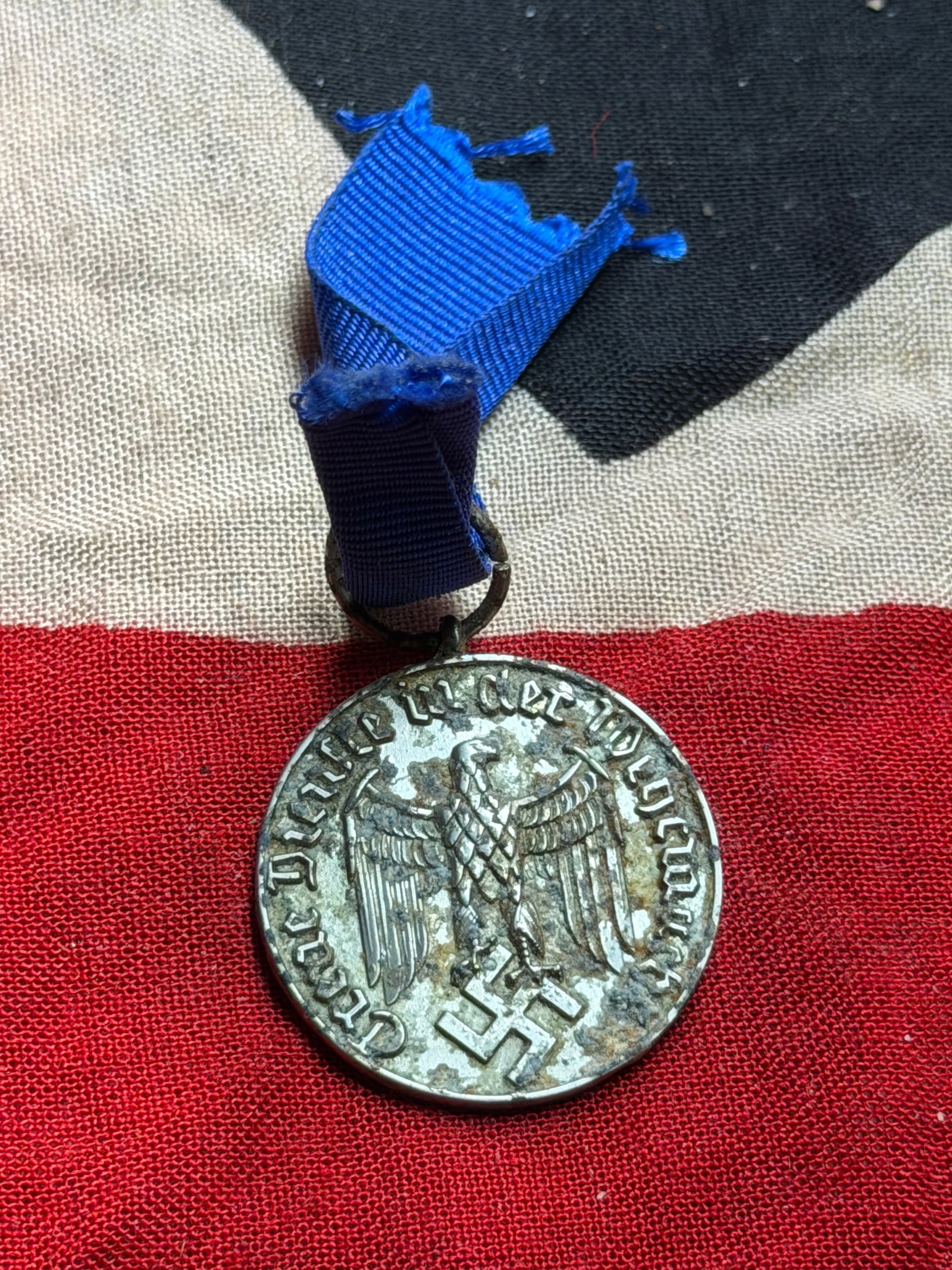 WW2 12-Year Service Medal of the National Socialist German Workers’ Party (NSDAP): This medal is the NSDAP Long Service Award for 12 Years, instituted in 1938 to recognize sustained service and loyalty within the National Socialist Party and its affiliated organizations. Suspended f