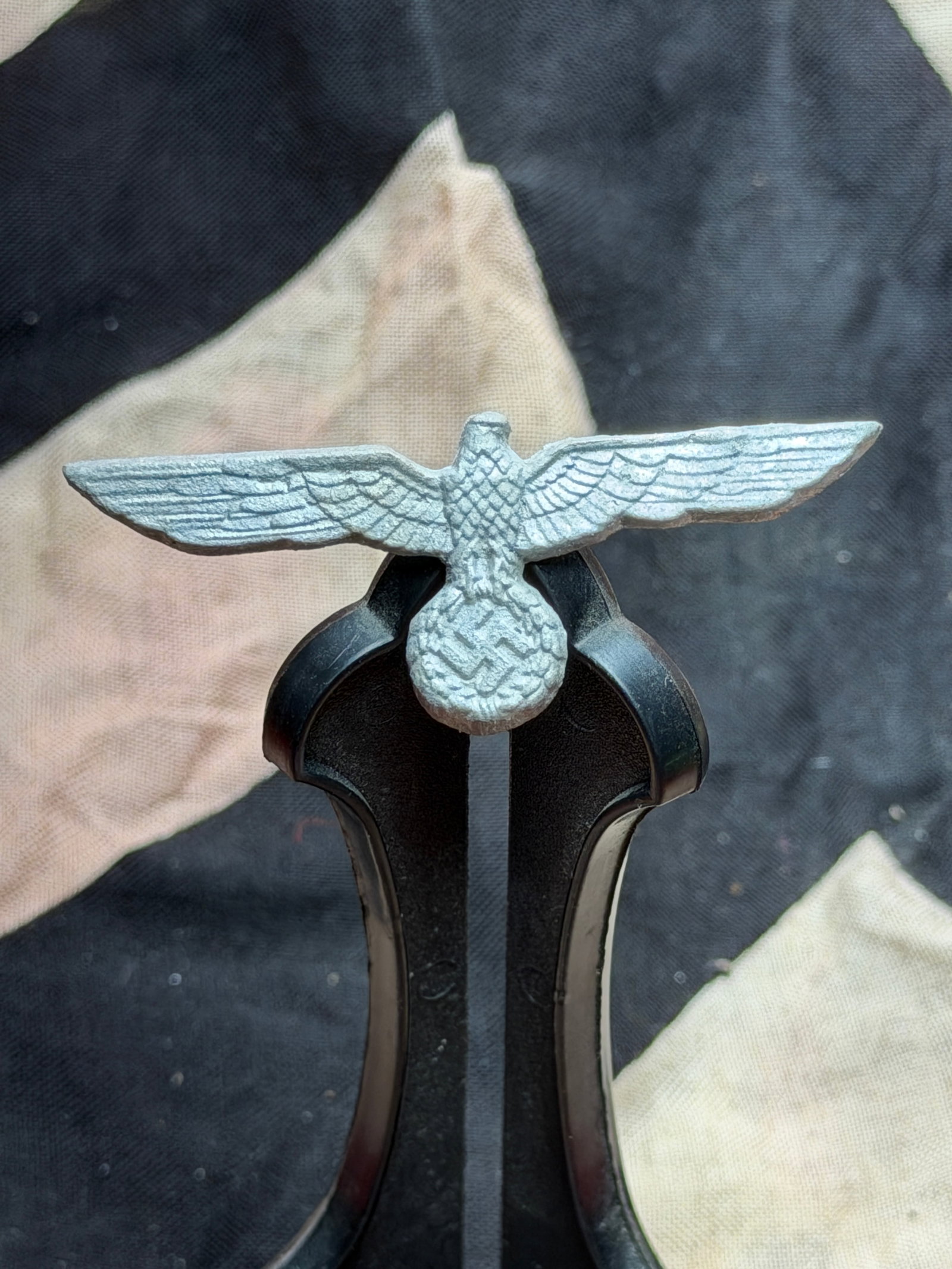 WW2 German Reich Eagle Insignia (Uniform or Equipment Emblem): This cast-metal Reich eagle emblem dates to the period of National Socialist rule in Germany (1933–1945). The stylized eagle with outstretched wings was a central state symbol of the Third Reich and