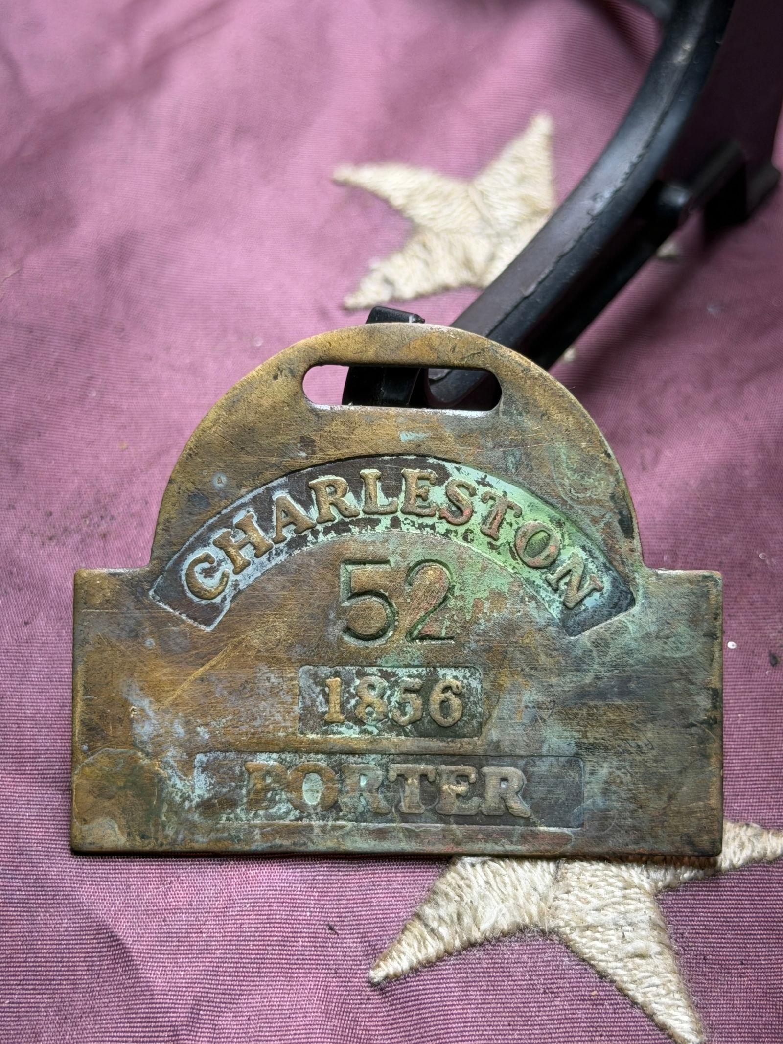 Charleston Porter Number 52 Slave Tag Servant Id Badge, 1856: This brass occupational badge, dated 1856 and marked “Charleston” and “Porter,” was issued by municipal authorities in Charleston, South Carolina, to identify a licensed porter operati