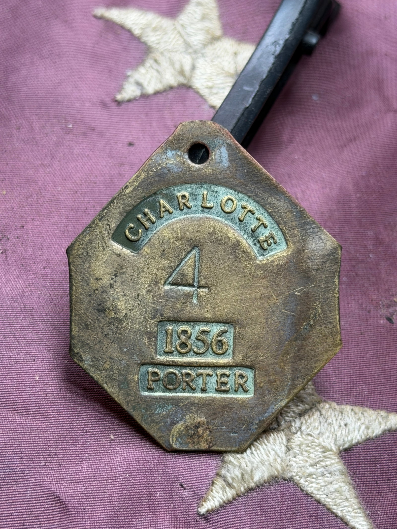 1856 Charlotte, NC Brass Porter Badge No. 4 – Antebellum Era Occupational Tag Servant Id Slave Tag: Mid-19th century brass occupational badge issued in Charlotte, North Carolina, dated 1856 and numbered 4, designated for a Porter. This heavy brass tag features crisp, period-correct raised lettering