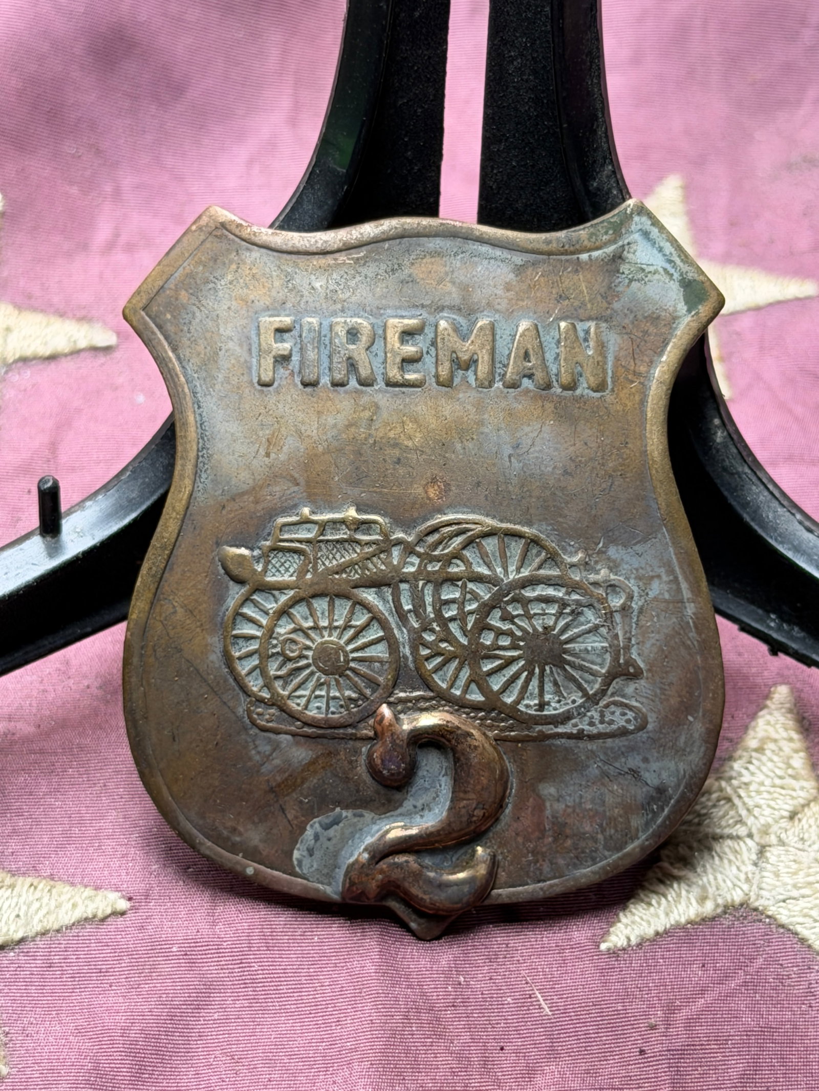 Civil War Era Volunteer Fireman’s Shield Badge, No. 2: This embossed metal fireman’s shield badge dates to the era of America’s volunteer fire companies, common in cities and towns during the mid-1800s. The front bears the word “FIREMAN” above