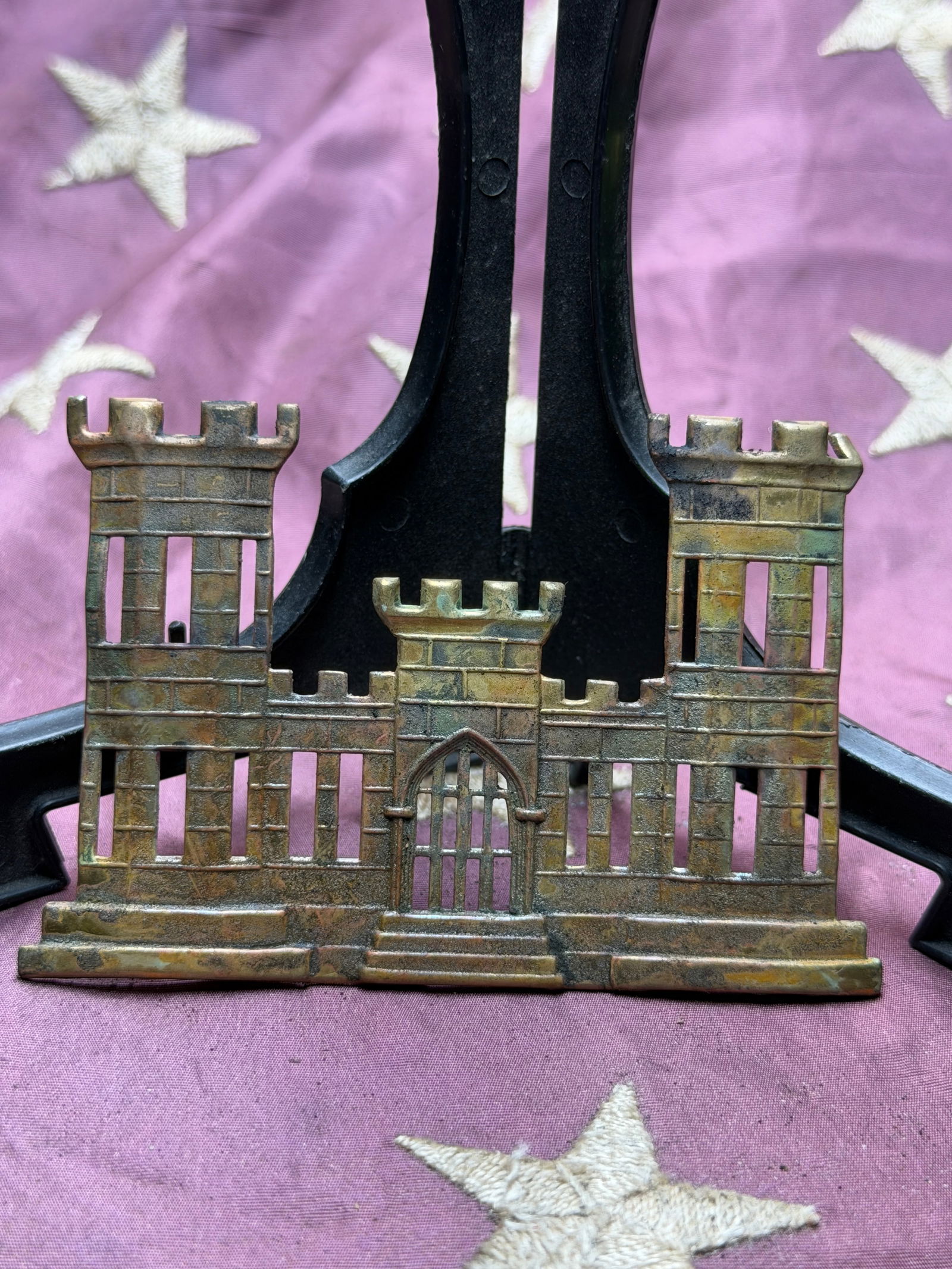 American Civil War U.S. Army Corps of Engineers Castle Insignia, c. 1861–1865: This cast brass headgear badge represents the distinctive castle emblem of the United States Army Corps of Engineers during the American Civil War. Worn on kepis or forage caps by engineer officers an