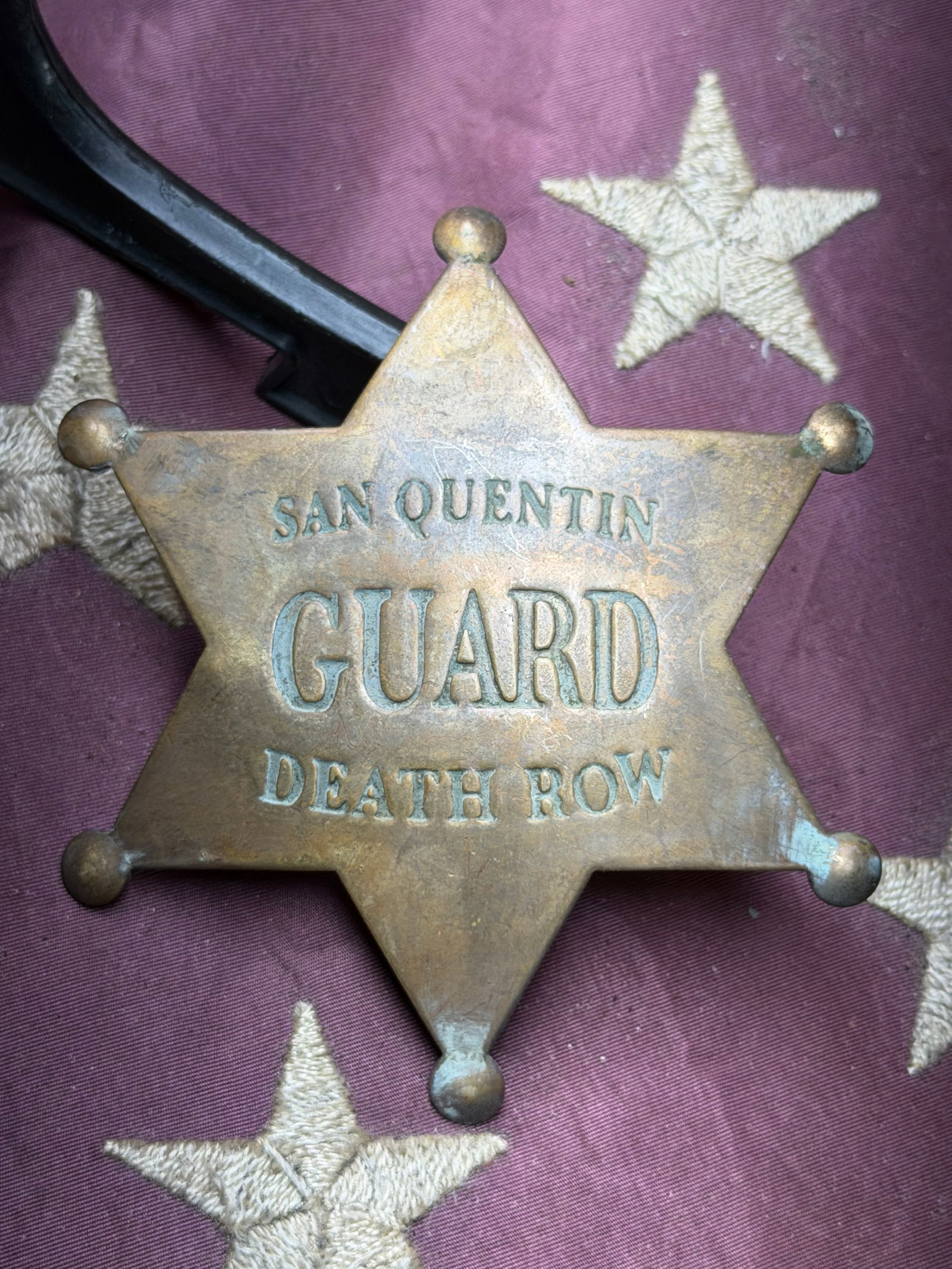 Early 1900's San Quentin State Prison Guard Badge, Death Row Assignment: This six-pointed brass badge was worn by a correctional officer assigned to Death Row at San Quentin State Prison, California. The obverse is stamped “SAN QUENTIN / GUARD / DEATH ROW,” clearly