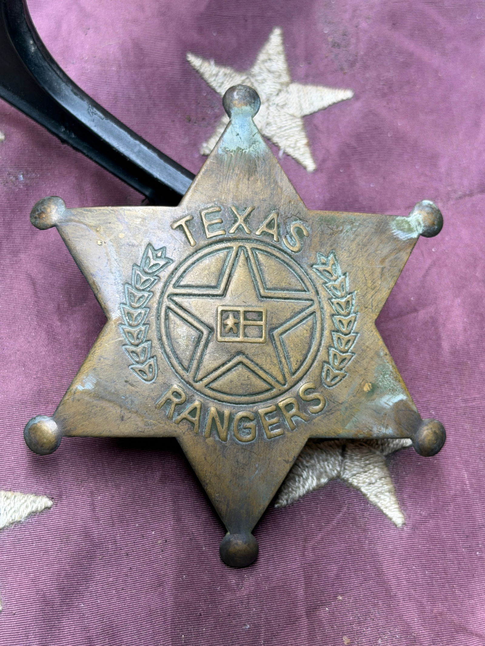 Antique 1800's Texas Rangers Six-Point Star Badge: This original six-point star badge represents the Texas Rangers, one of the oldest continuously serving law-enforcement organizations in the United States. Cast in brass with raised lettering reading