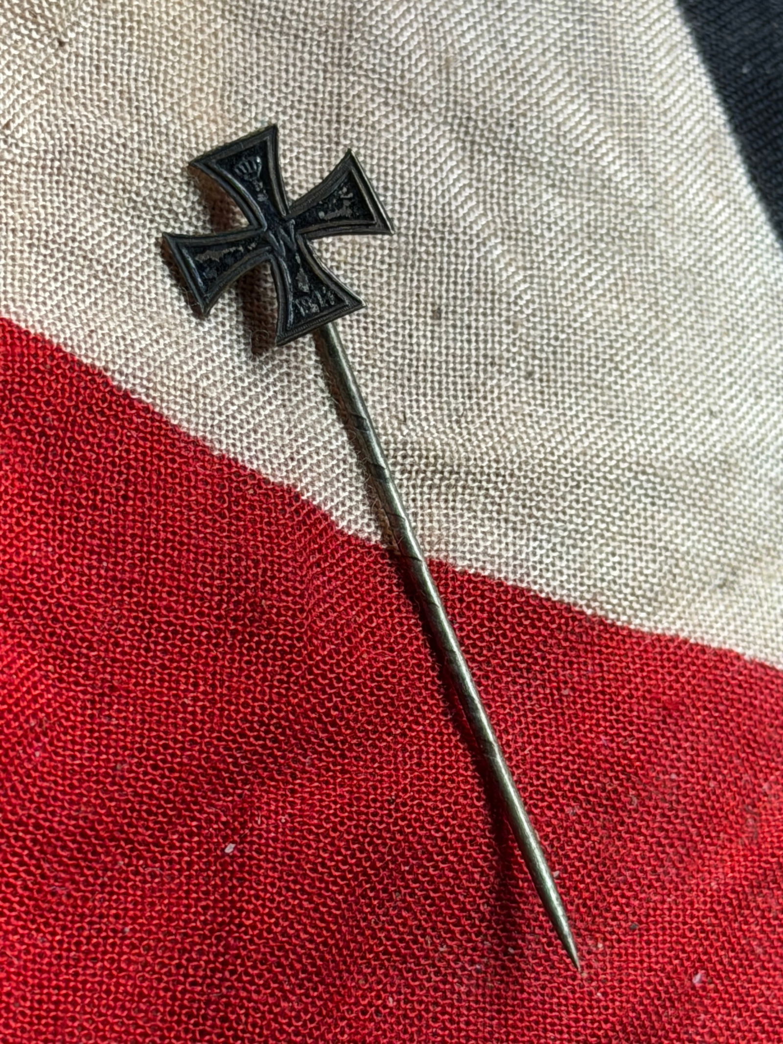 WW2 German Iron Cross Stickpin: This miniature Iron Cross stickpin represents a civilian and veterans’ form of Germany’s most enduring military decoration. The Iron Cross, originally instituted in 1813 during the Napoleonic Wars