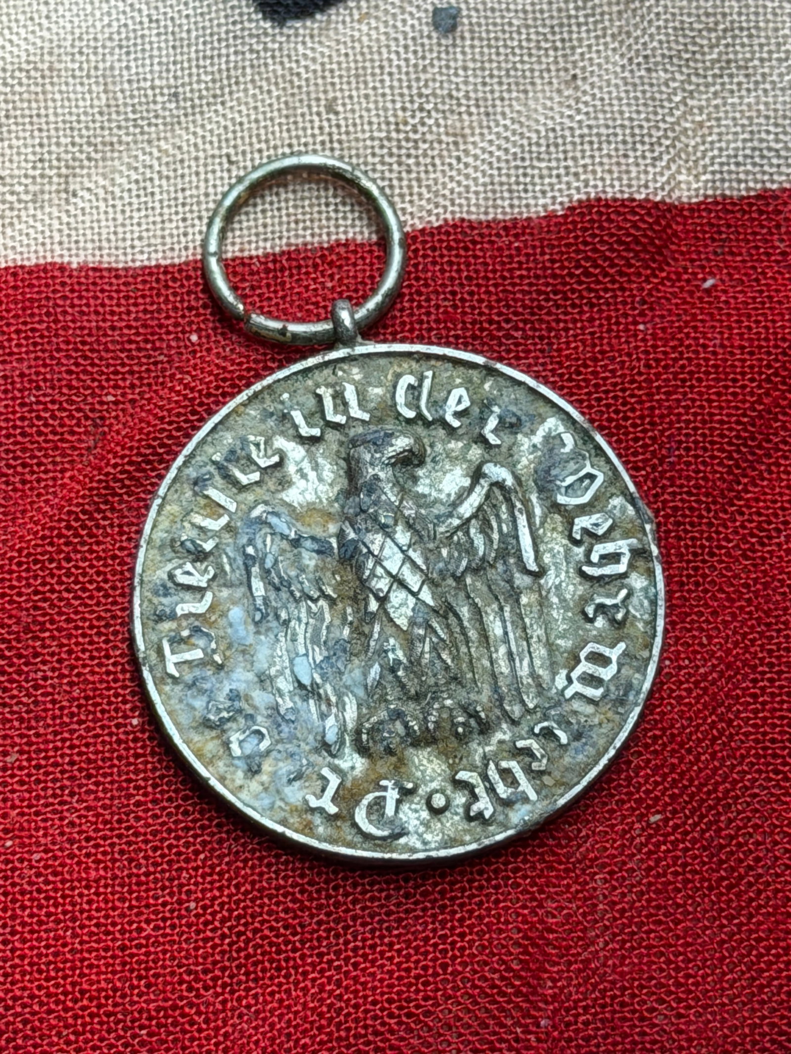 WW2 German Reich Membership or Long Service Medal: This medal dates to the period of the German Reich (1933–1945) and bears the inscription “Deutsches Reich” encircling the Reich eagle on the obverse. The reverse displays the number “12&rd