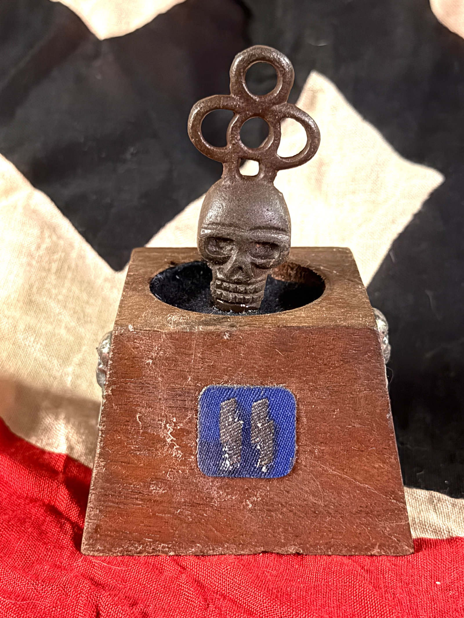 WW2 German Desk Seal with Death’s Head Finial and SS Insignia, Germany, Third Reich Period (c.: This object is a small wooden desk seal or stamp stand dating to the period of the Third Reich in Germany. The square wooden base is fitted with a metal finial featuring a Totenkopf (death’s head) m