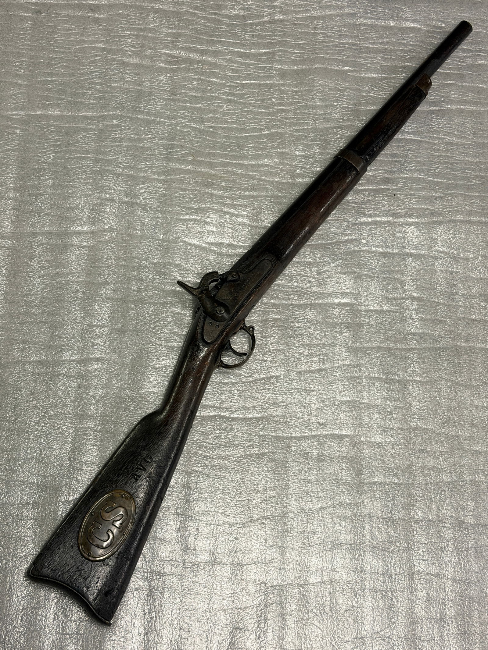 Civil War Era Percussion Rifle with “CS" Buttplate Augusta Arsenal – Marked H.P. Tichenor,: Civil War–era percussion rifle featuring a long octagonal barrel and period iron furniture. The rifle is fitted with a brass oval buttplate inset marked “CS”, commonly associated with Confed
