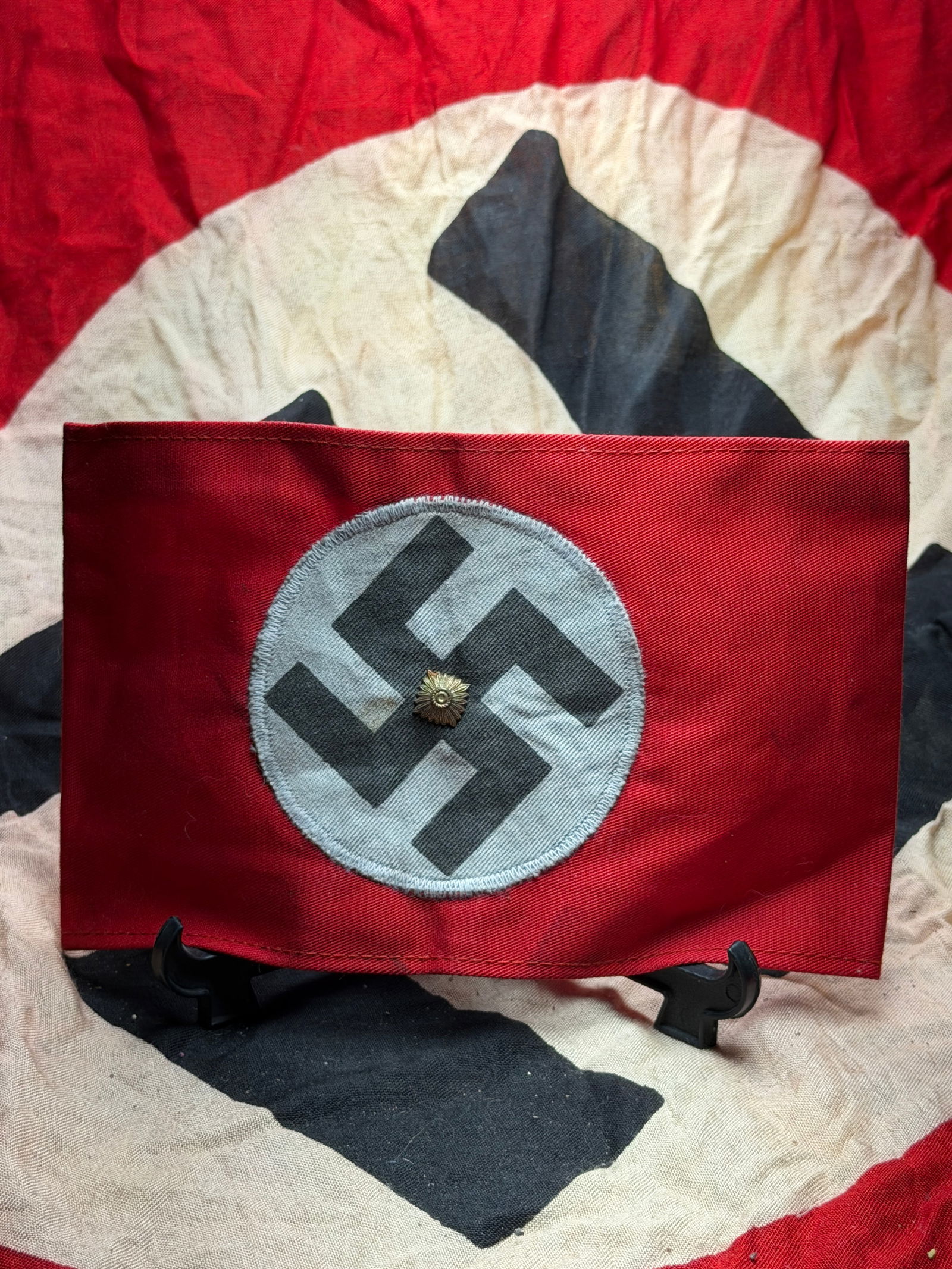 WW2 German National Socialist Party Armband (NSDAP Armbinde): This armband is an original example of the National Socialist German Workers’ Party (NSDAP) insignia worn in Germany during the Third Reich (1933–1945). Constructed of red cotton fabric, it featur