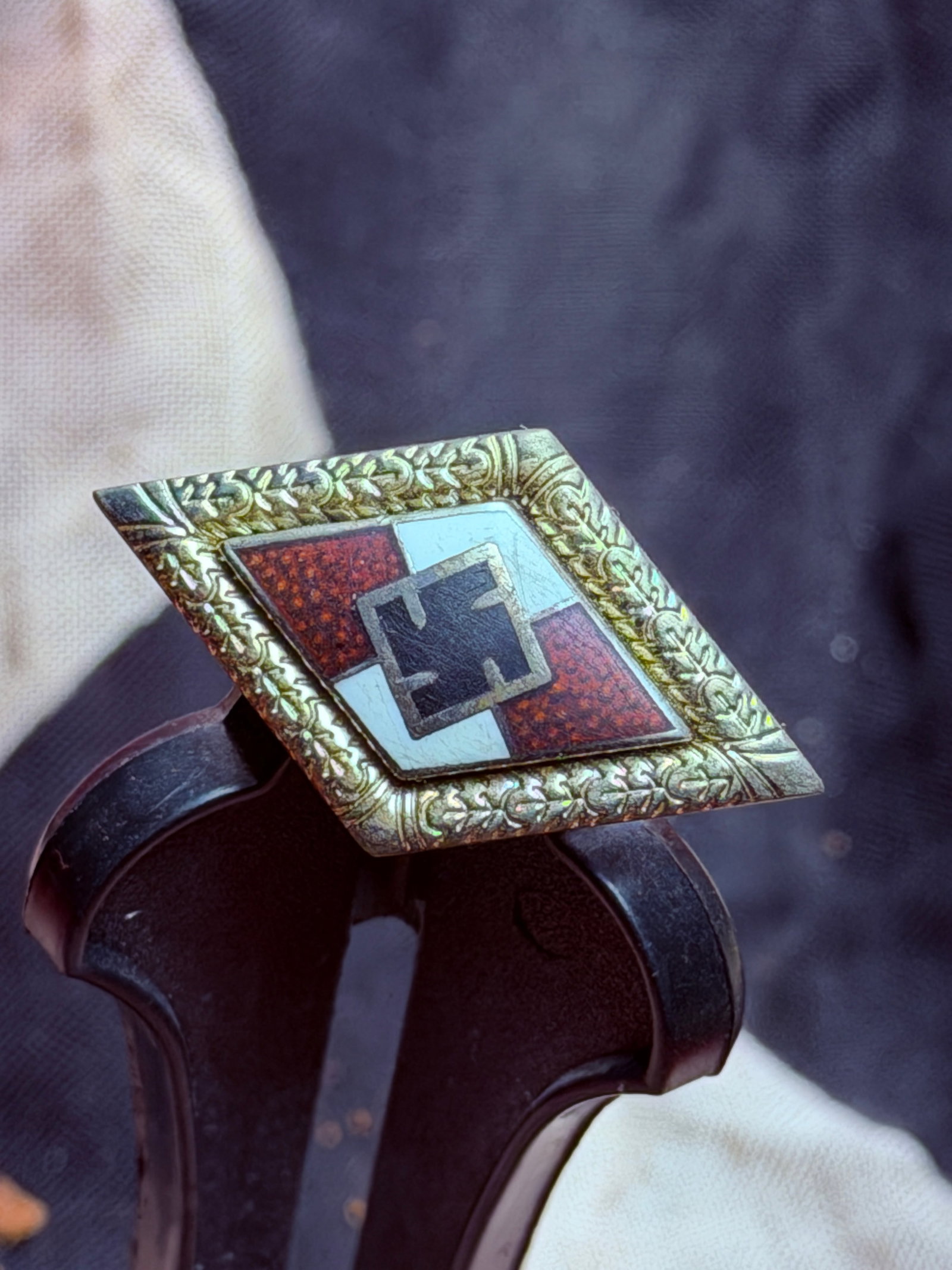WW2 German Hitler Youth Membership Badge (HJ-Abzeichen): This enamelled diamond-shaped badge is a membership insignia of the Hitler Youth (Hitlerjugend), the youth organization of Nazi Germany. Produced in large numbers from the early 1930s through the end 