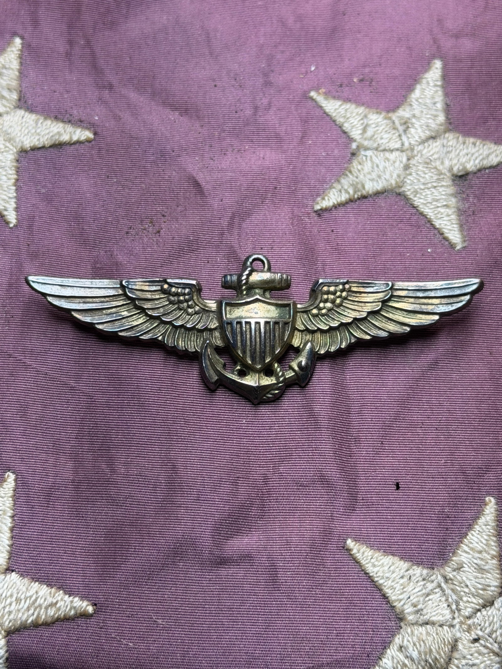 World War II U.S. Navy Aviator Wings – AMICO Sterling Silver Pilot Badge: Original World War II–era U.S. Navy Aviator wings, manufactured by AMICO and clearly hallmarked “AMICO STERLING” on the reverse. This classic WWII naval aviation badge features outstretched 