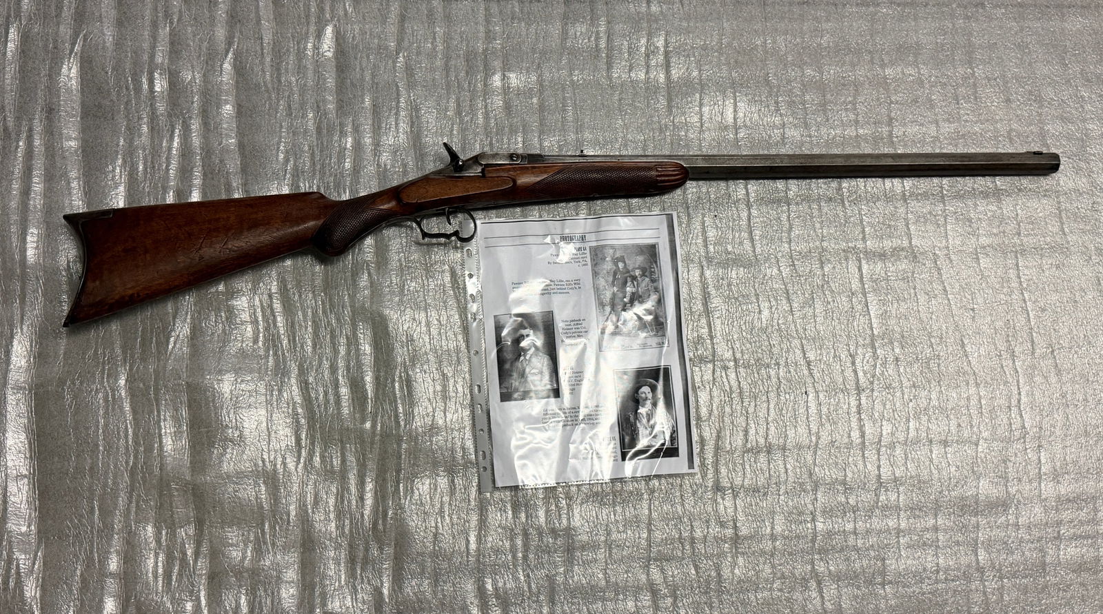 Antique Sporting Rifle Owned By May Lillie (1893): This finely crafted single-shot sporting rifle represents the transitional firearms culture of the post–American Civil War period, when Civil War–era technology continued to shape civilian and exh